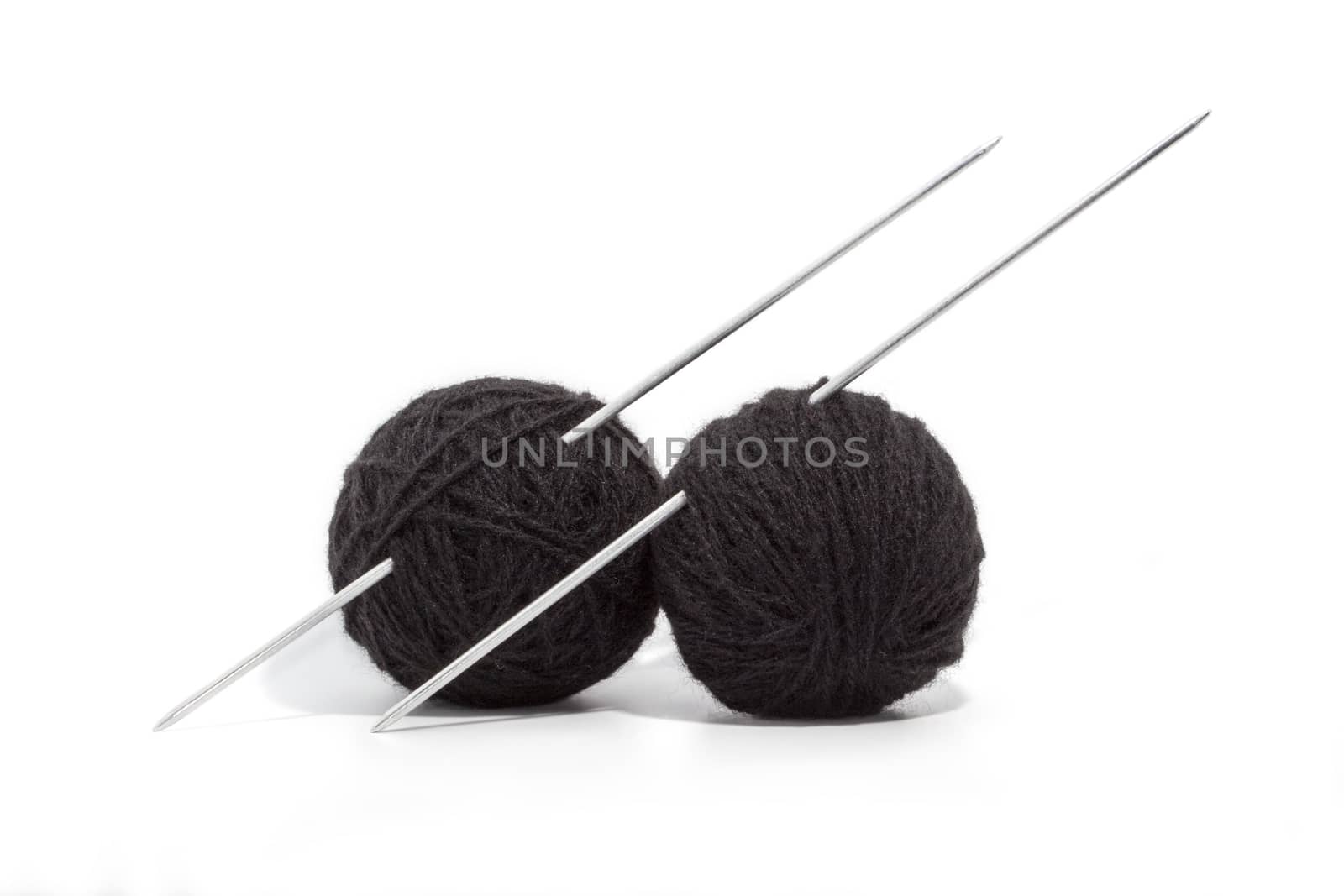 balls of yarn and knitting needles by Olvita