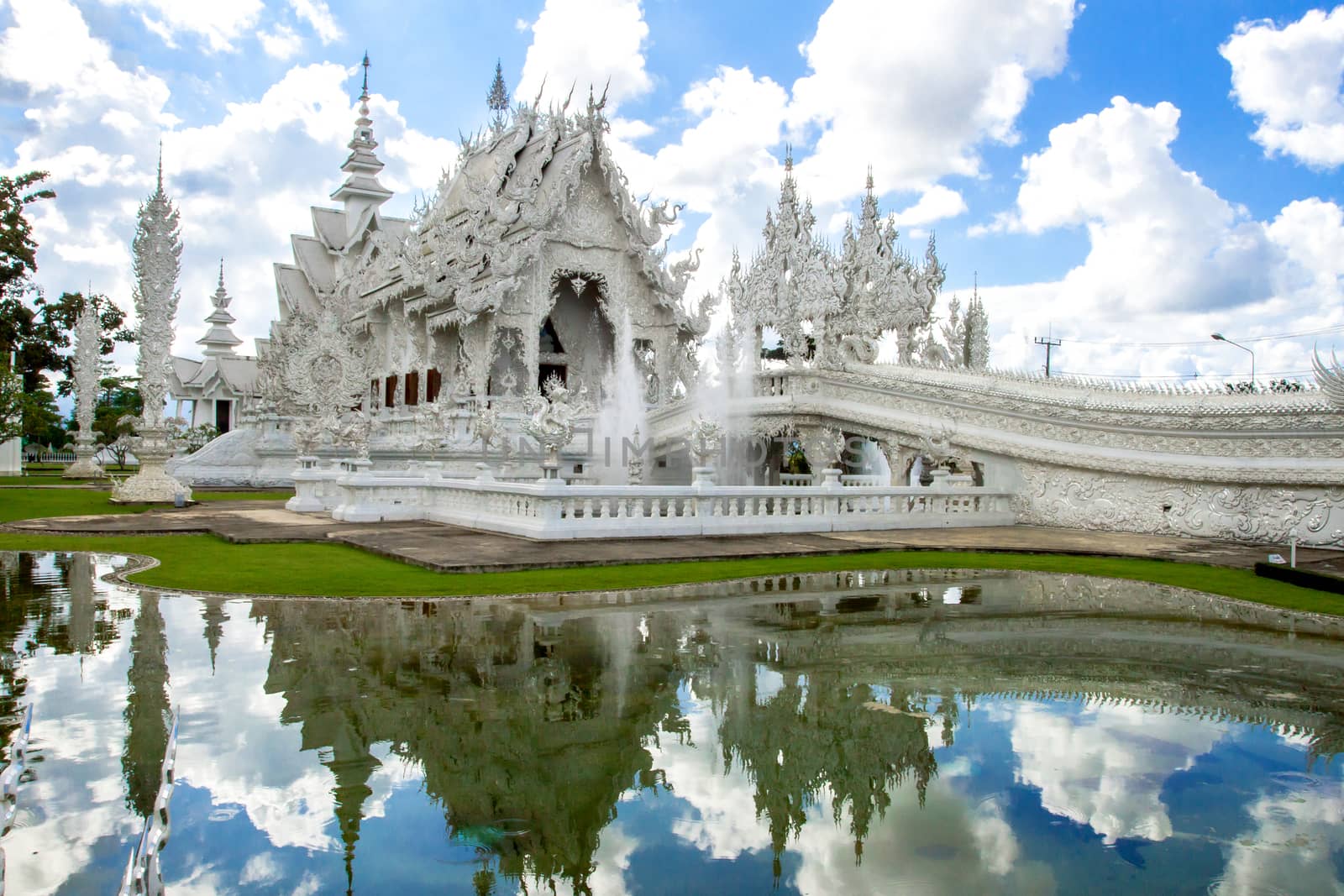 white church in Wat Rong Khun, Chiang Rai province by kannapon