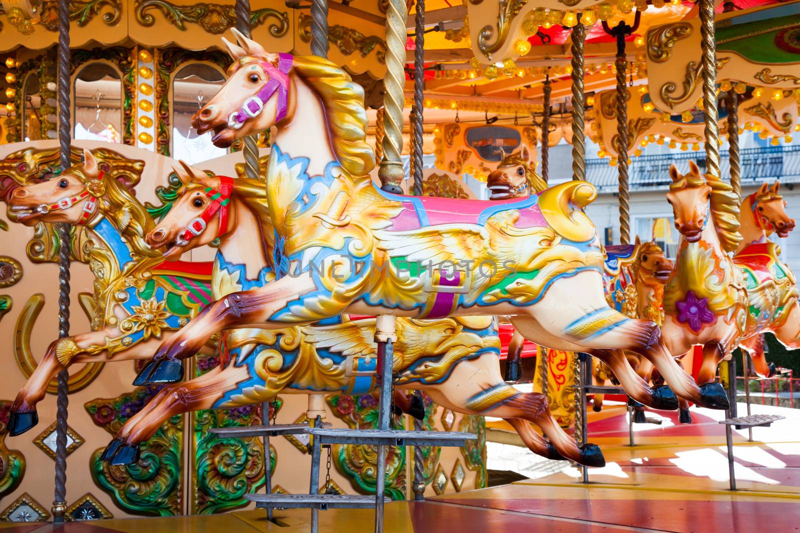 Fairground carousel horses during the day