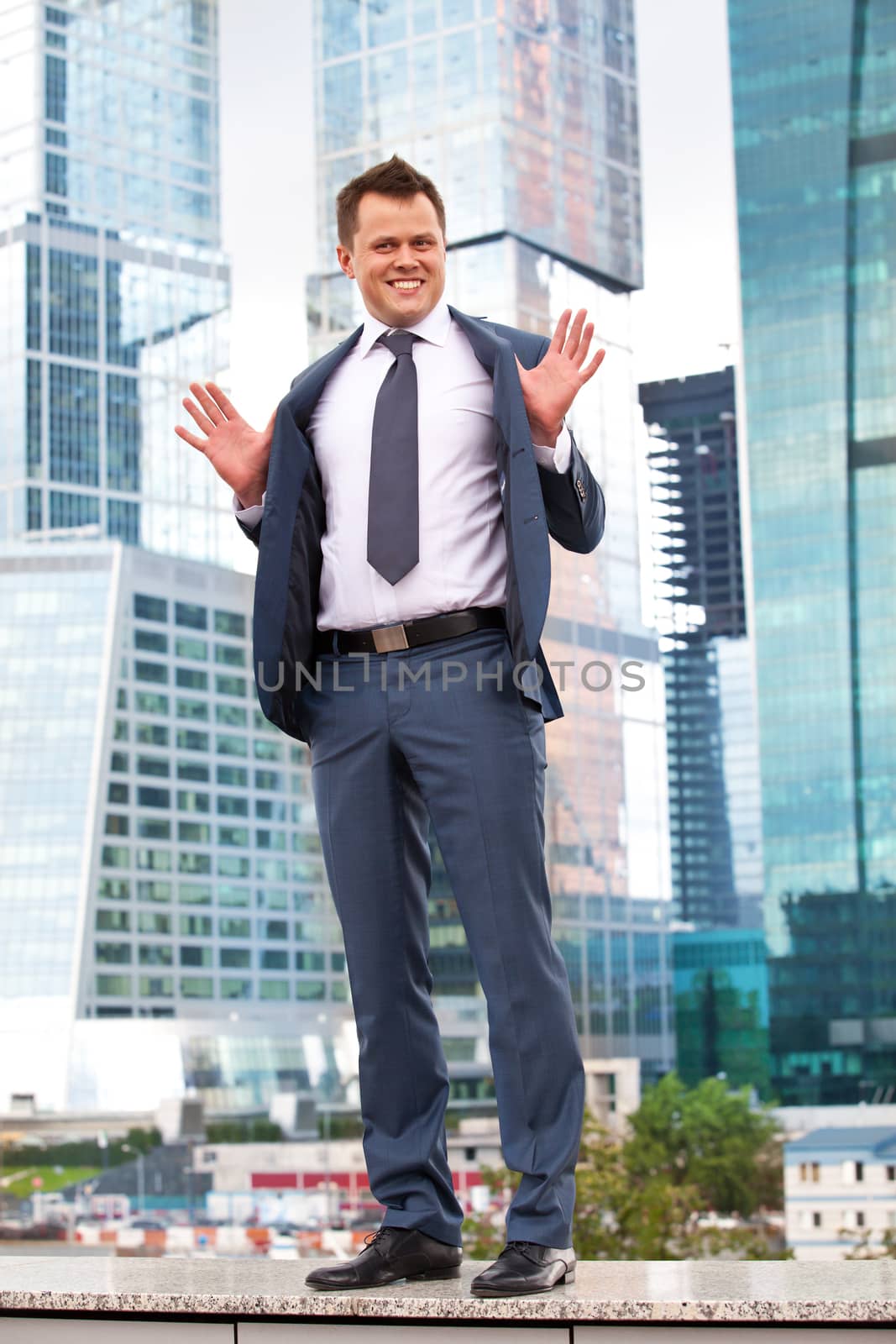 successful businessman on the background of office buildings