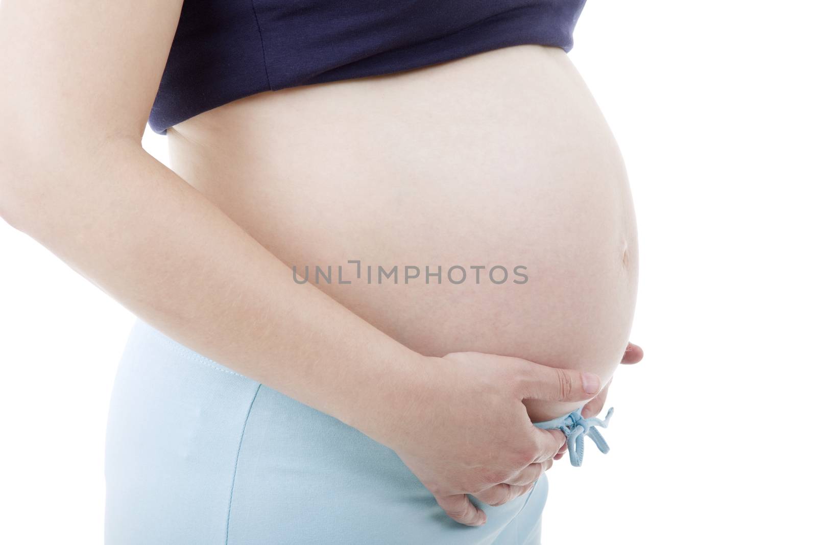 Closeup of pregnant woman at white background