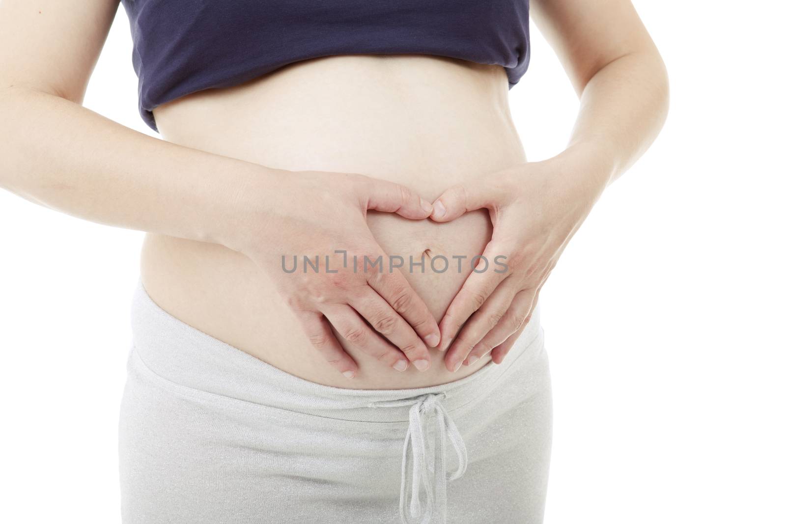 Closeup of pregnant woman at white background