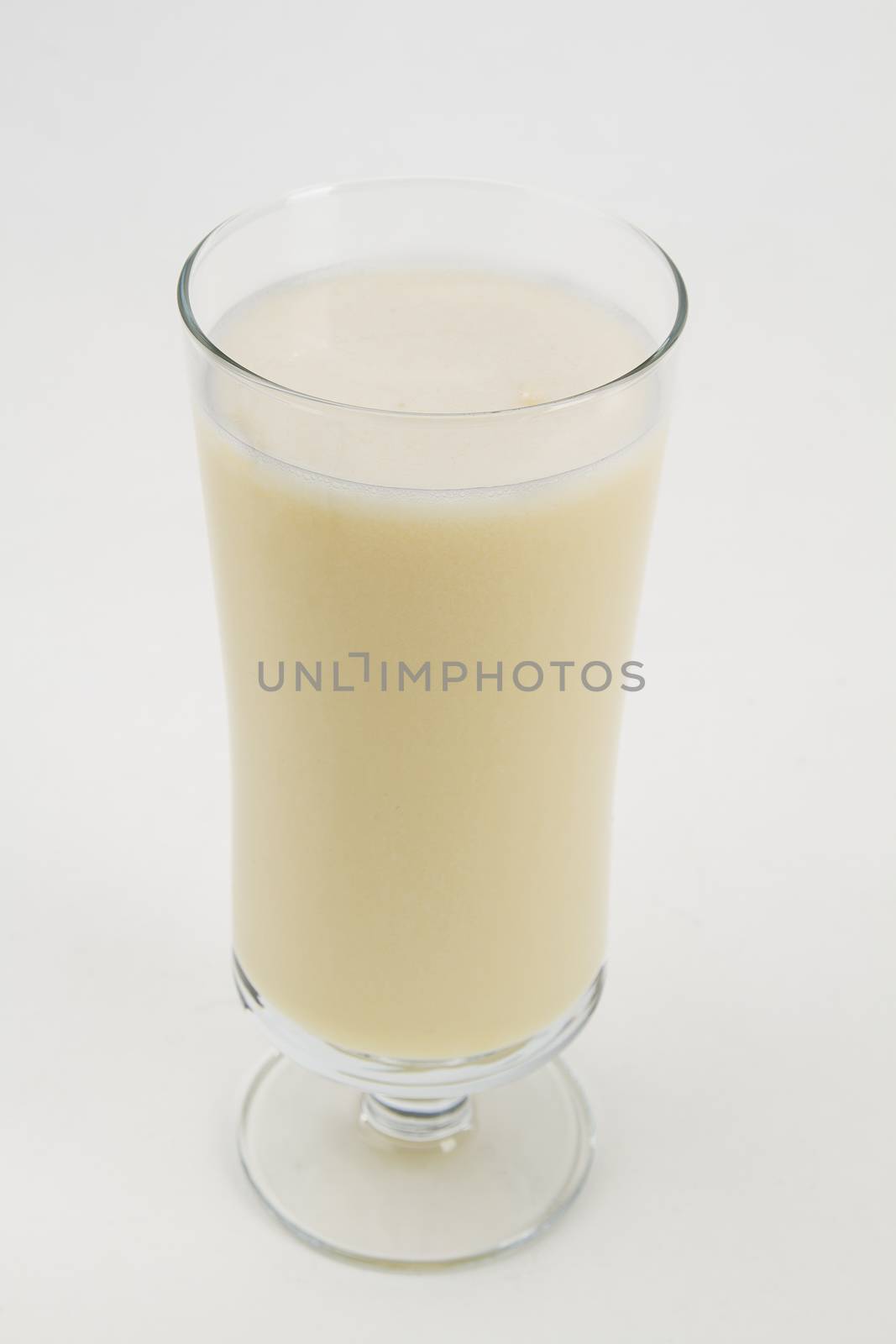 Vanilla milkshake against a white background