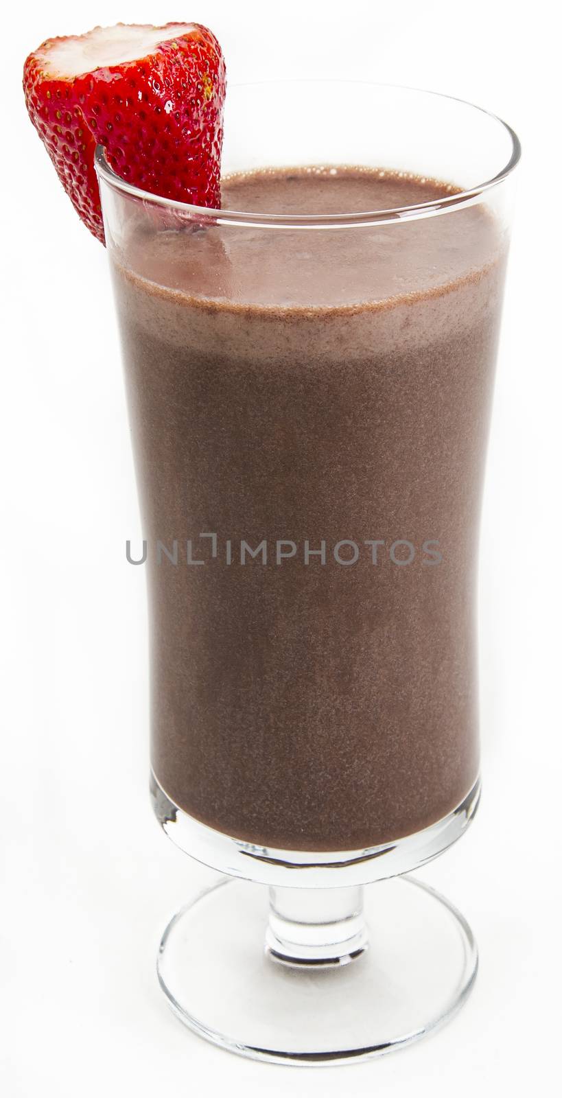 Chocolate milkshake with a strawberry on the side against a white background