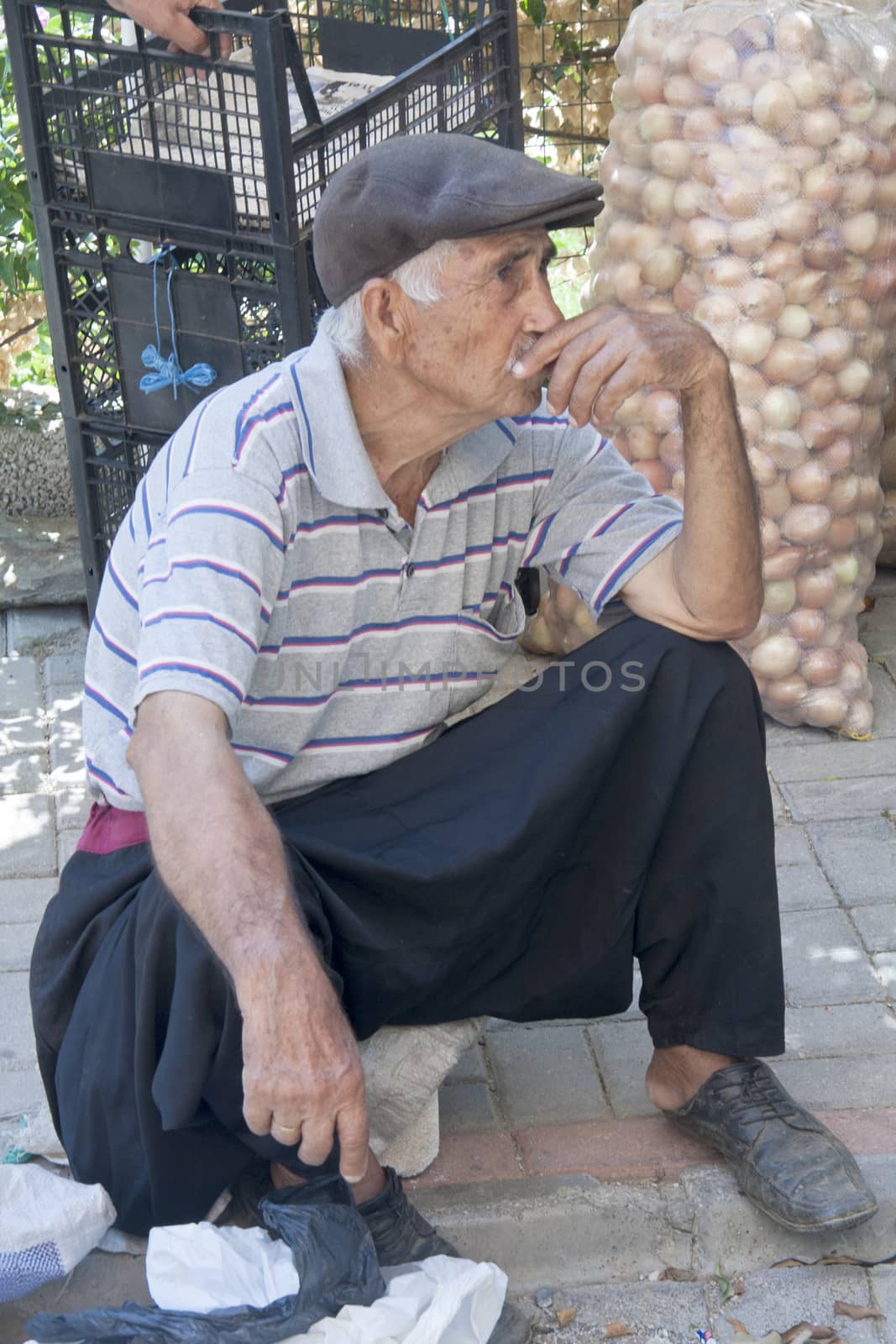 Alanya, Turkey-September 20th 2011: Man wearing a cap and traditional traditional fishermen's pants. Many of the older men still wear the traditional pants.