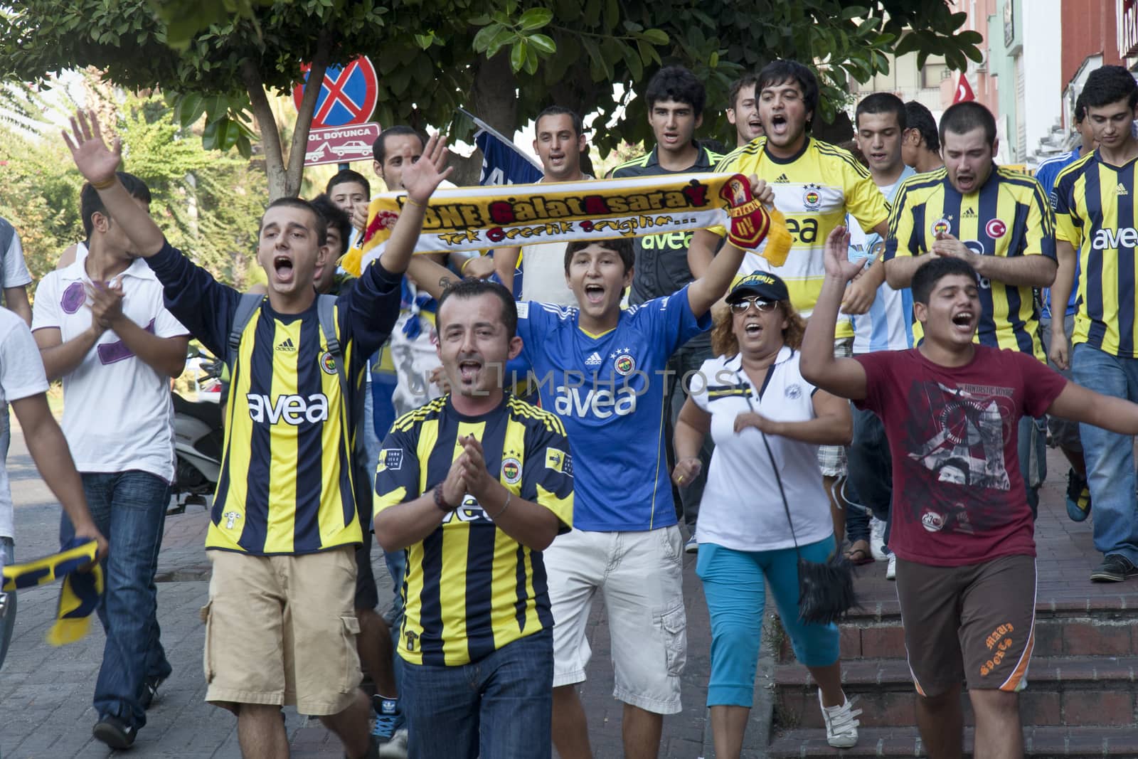 Alanya, Turkey-September 24th 2011. Fenerbahce football supporters march through Alanya prior to a game. Founded in 1907, the club is located in Istanbul.