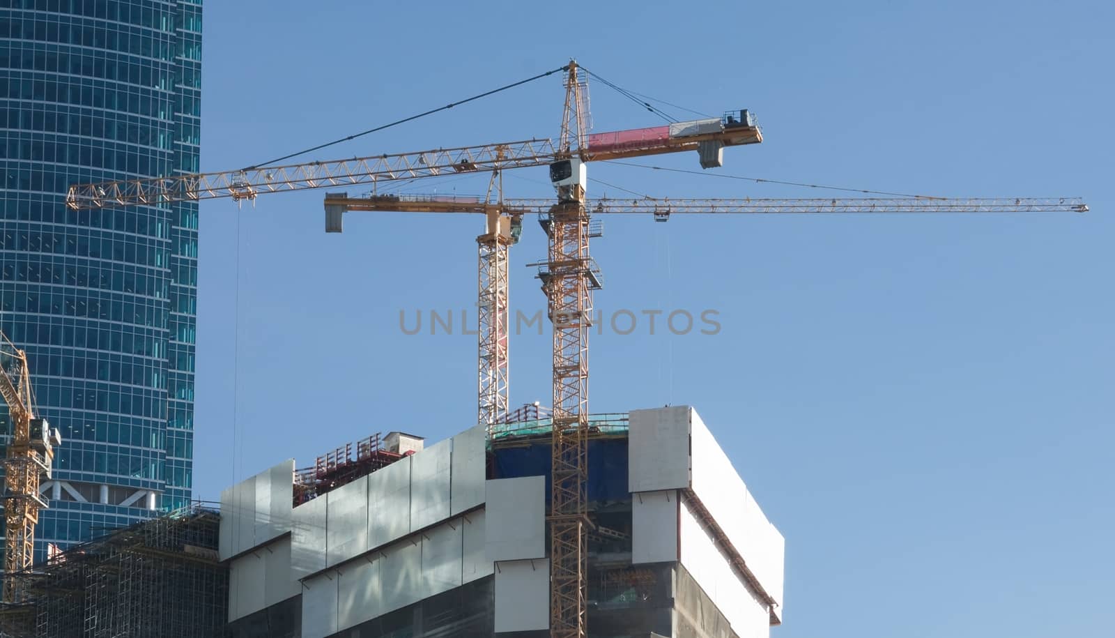 Elevating cranes at a construction site in Moscow