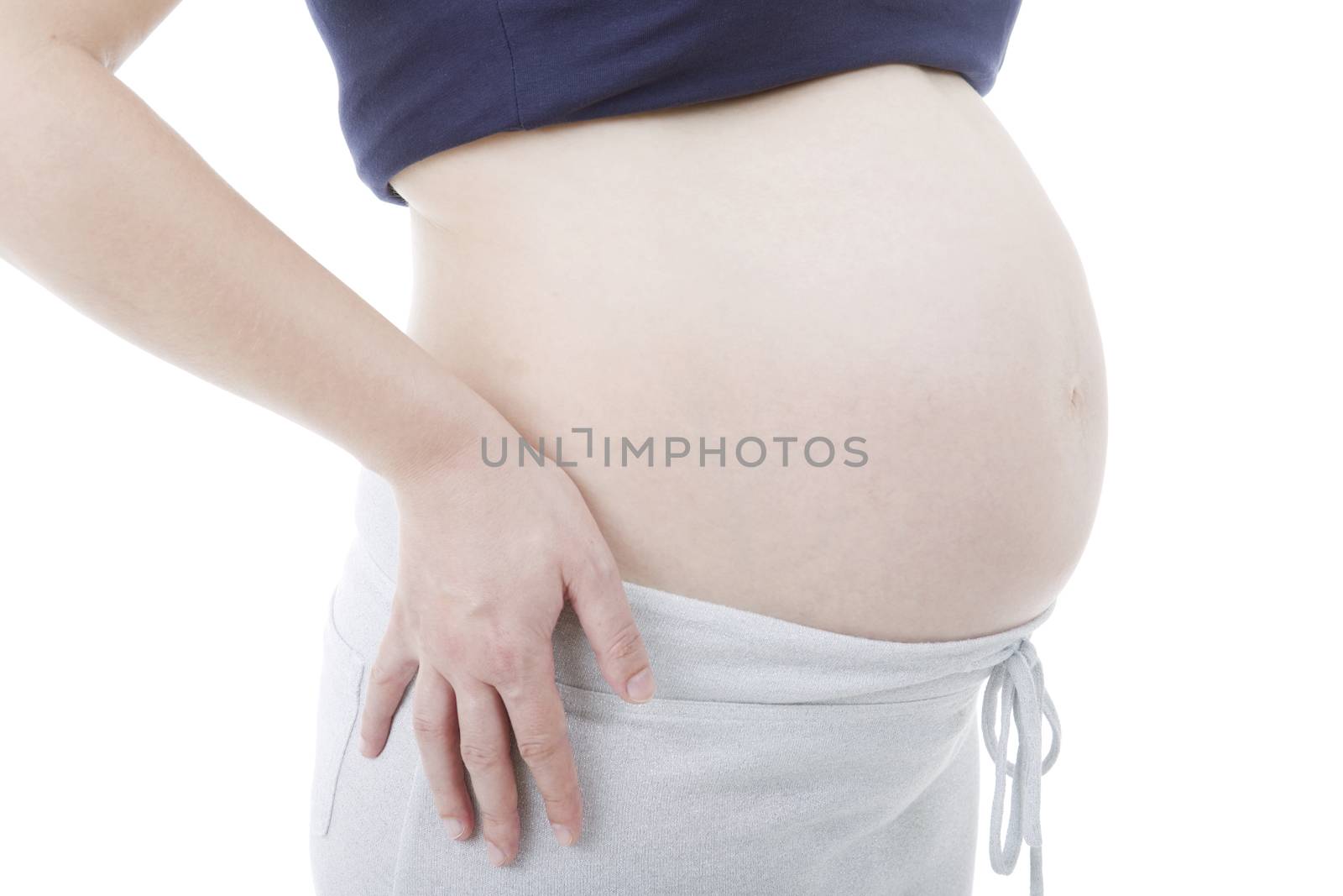 Closeup of pregnant woman at white background