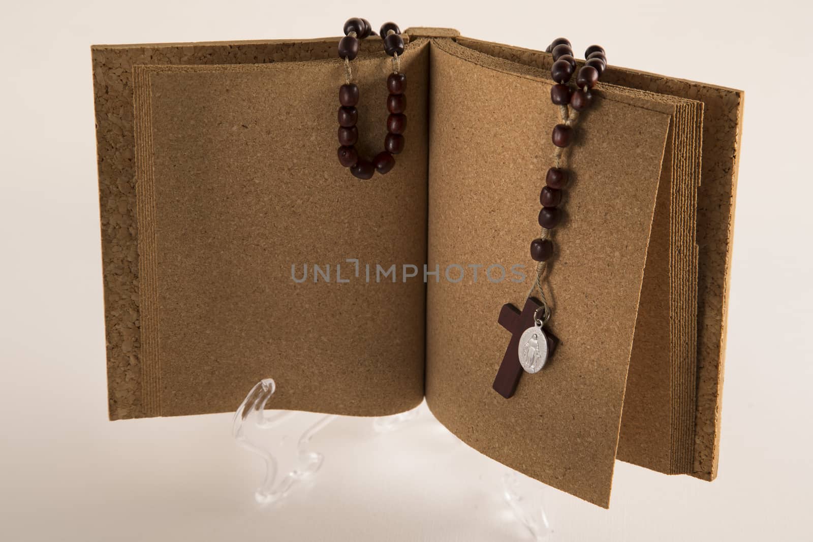 Holy Rosary necklace on cork book by paocasa