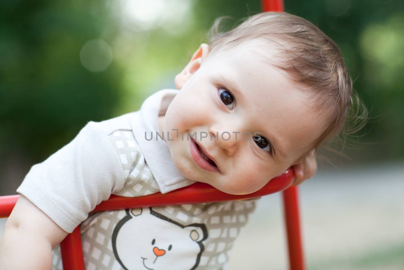child on the swing by vsurkov