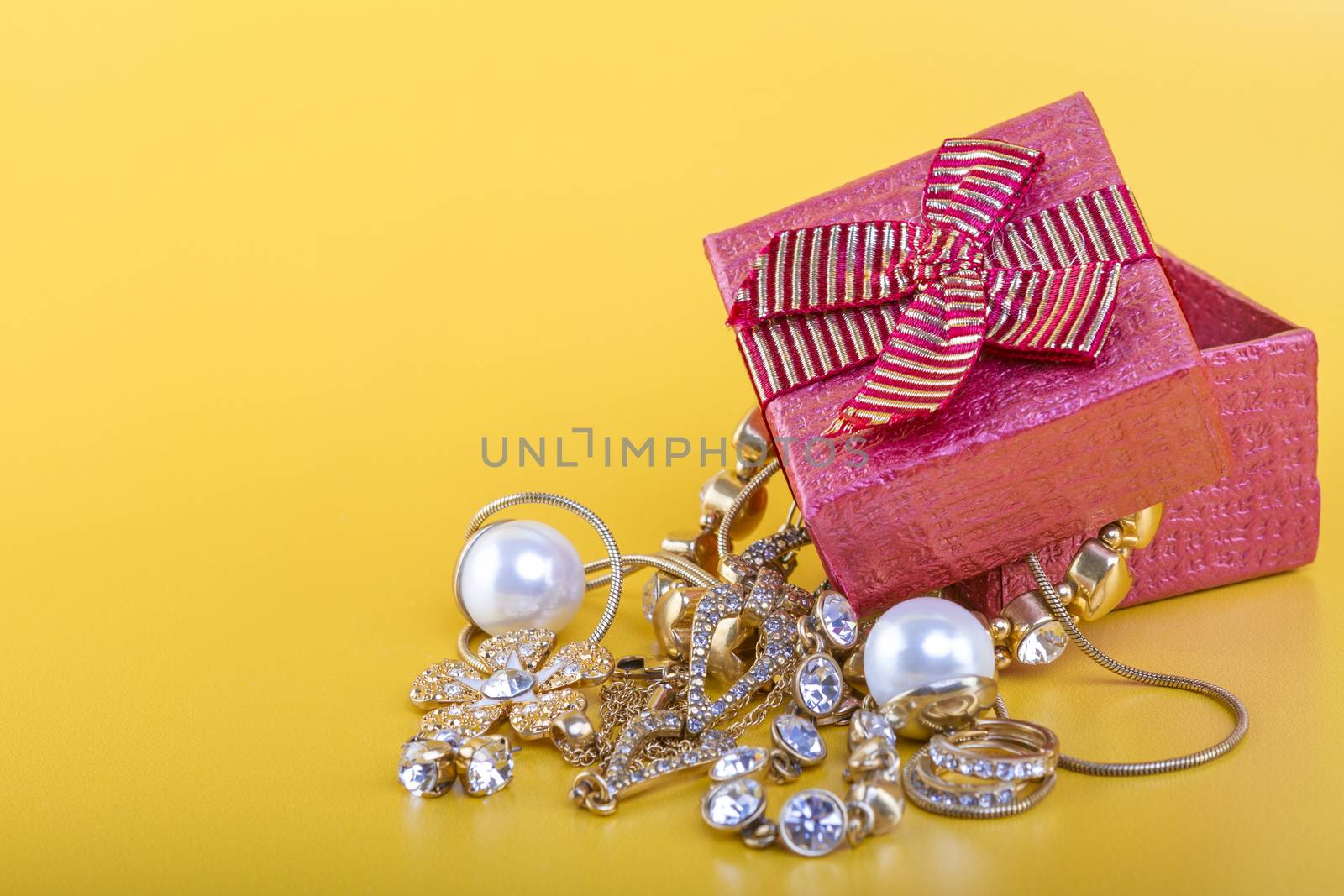 Jewlery gift box on yellow background