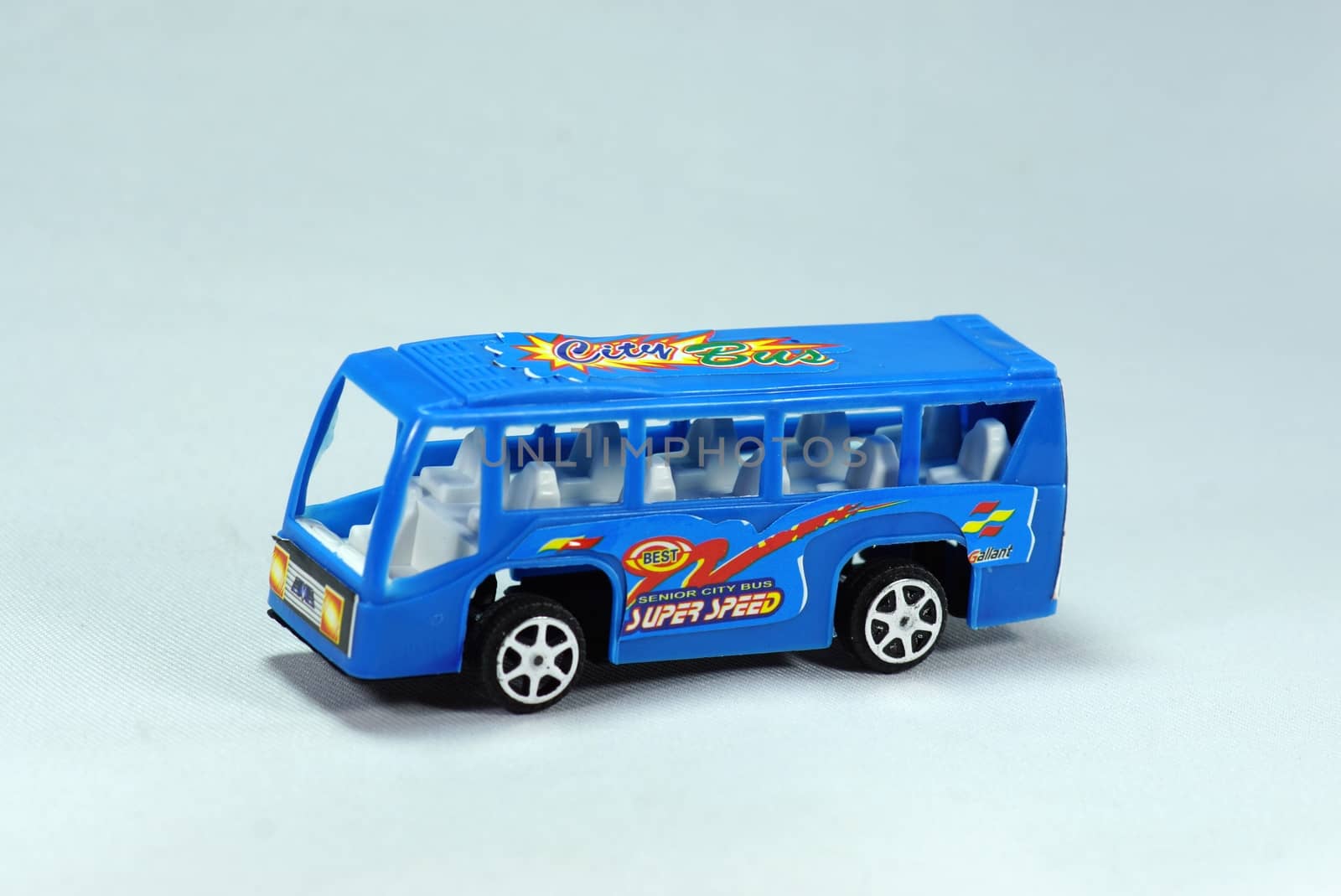 model of blue minibus on white scene,shallow focus