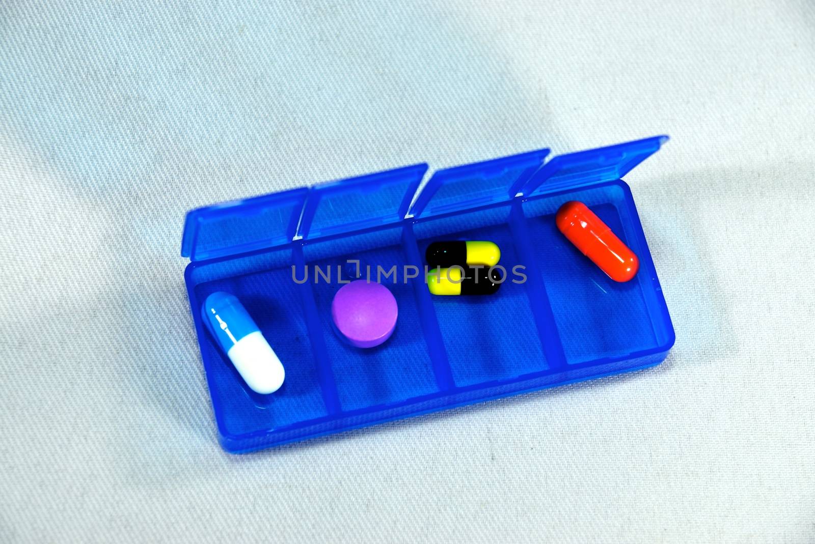 colourful pills box by nattapatt