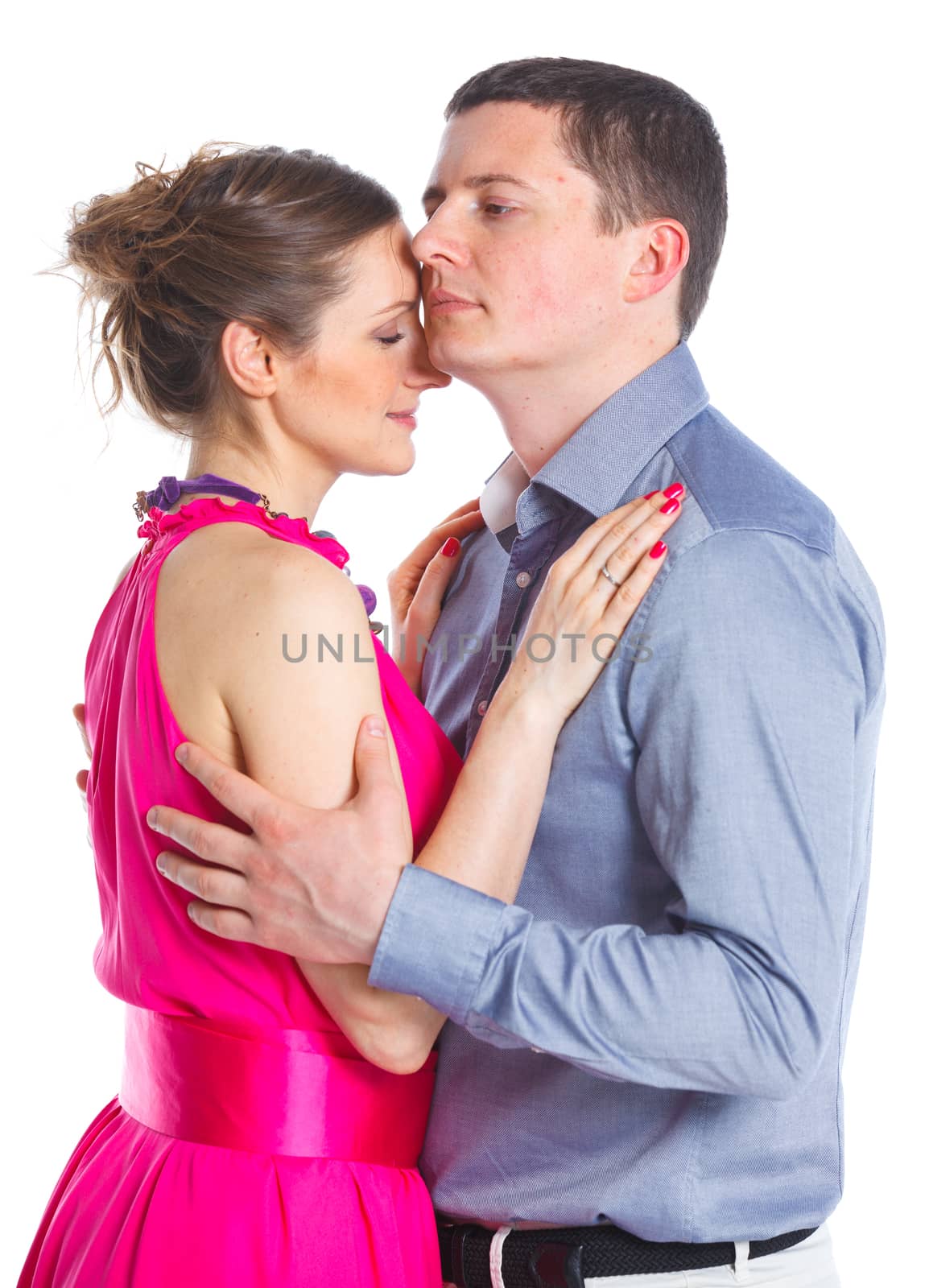 Happy couple. Attractive man and woman being playful. Isolated on white background.