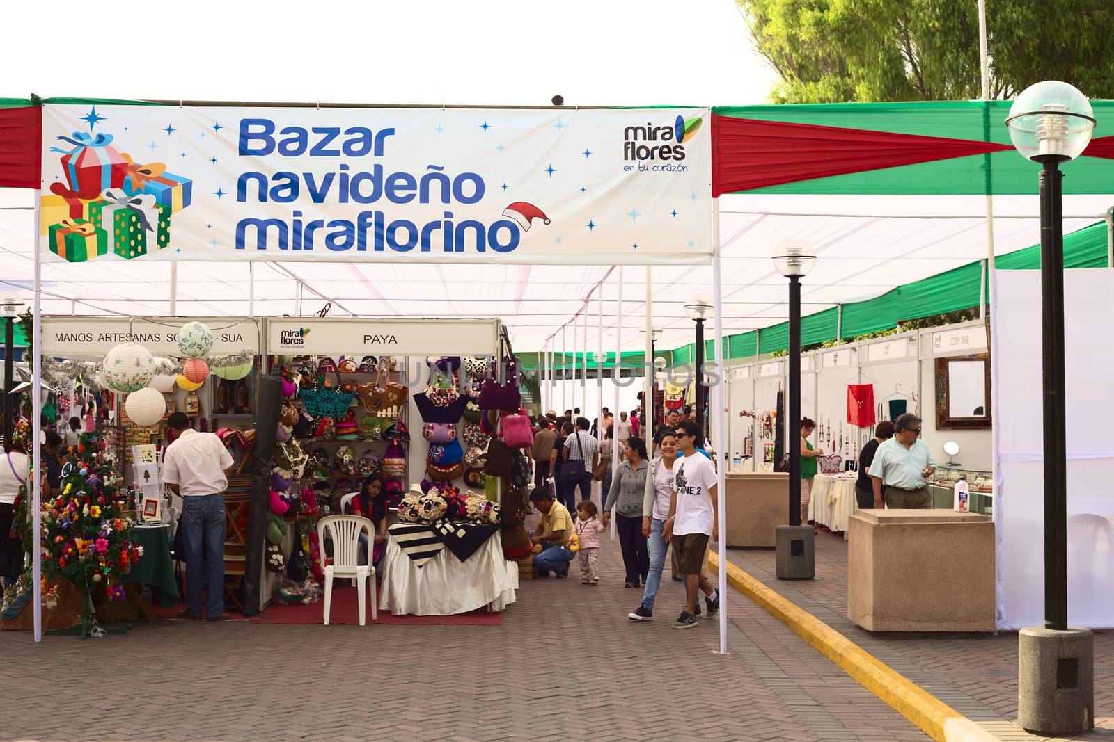 LIMA, PERU - DECEMBER 13, 2011: Unidentified people on the Bazar Navide�o Miraflorino (Miraflores Christmas Market) at the Kennedy Park on December 13, 2011 in Lima, Peru. Different handicrafts, both traditional and modern, are being sold on the Christmas Fair.