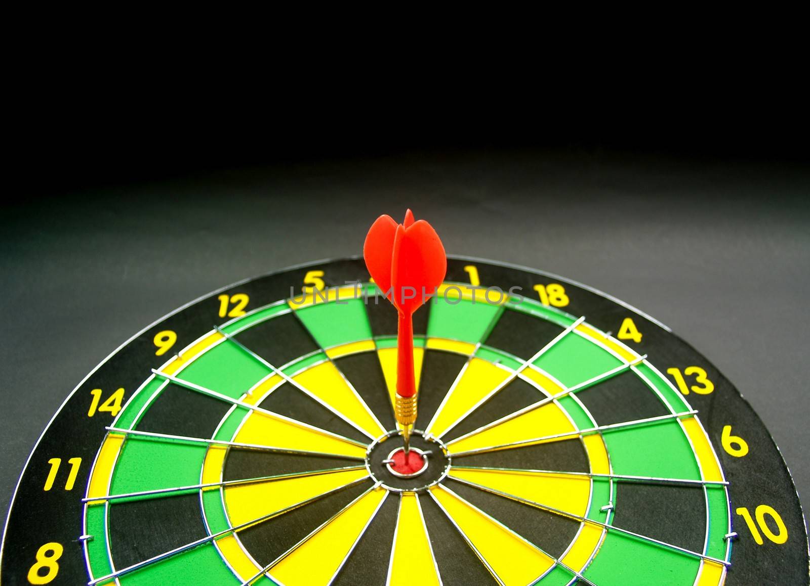 dartboard darts arrows in the target 