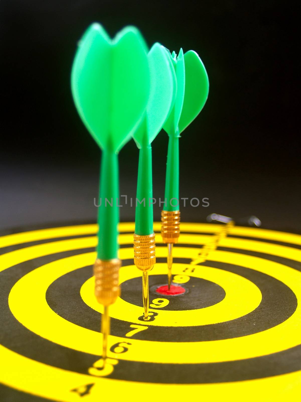 dartboard darts arrows in the target  by kiddaikiddee
