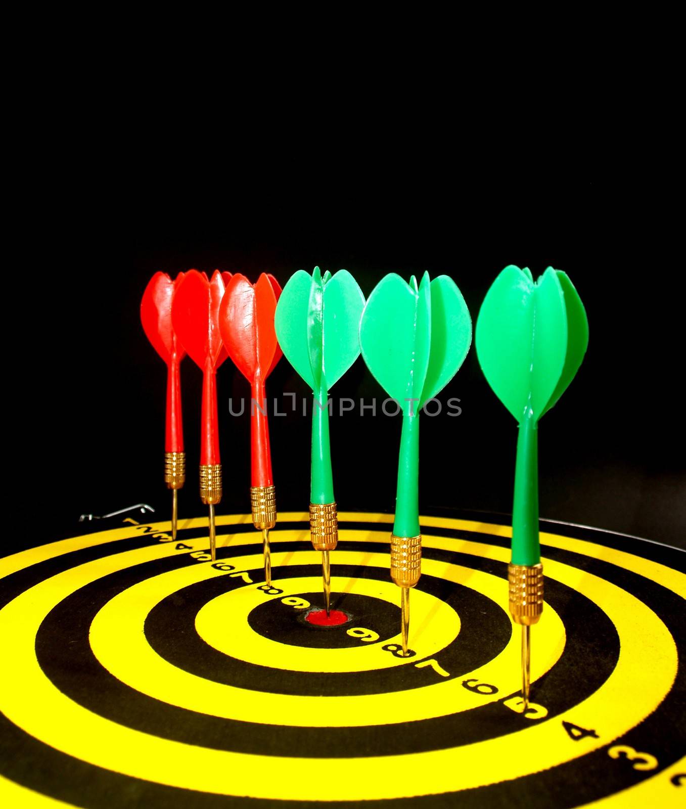 dartboard darts arrows in the target  by kiddaikiddee