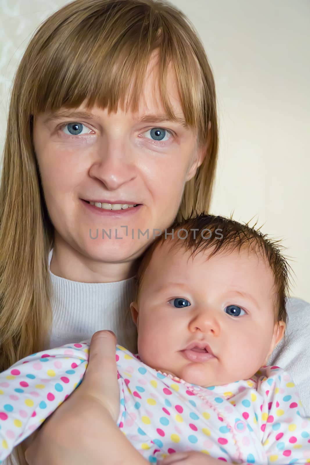 Image of cute newborn infant girl and mother