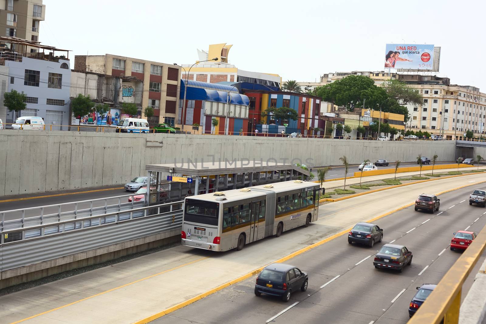 LIMA, PERU - FEBRUARY 13, 2012: Metropolitano bus stopping at Ricardo Palma Avenue in Miraflores on February 13, 2012 in Lima, Peru. The Metropolitano is a Bus rapid transit system operating since 2010 in Lima running from North to South.