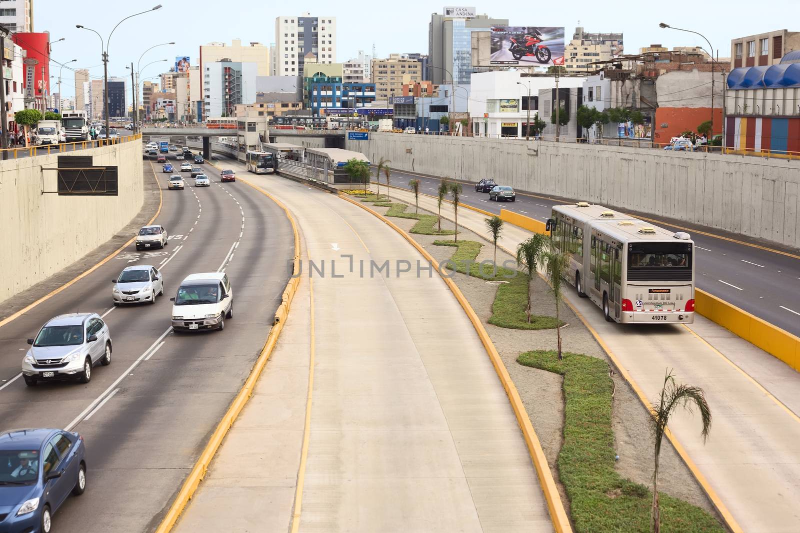 LIMA, PERU - FEBRUARY 13, 2012: Metropolitano bus stop at the crossing of the Avenues Ricardo Palma and Paseo de la Republica in Miraflores on February 13, 2012 in Lima, Peru. The Metropolitano is a Bus rapid transit system operating since 2010 in Lima running from North to South.