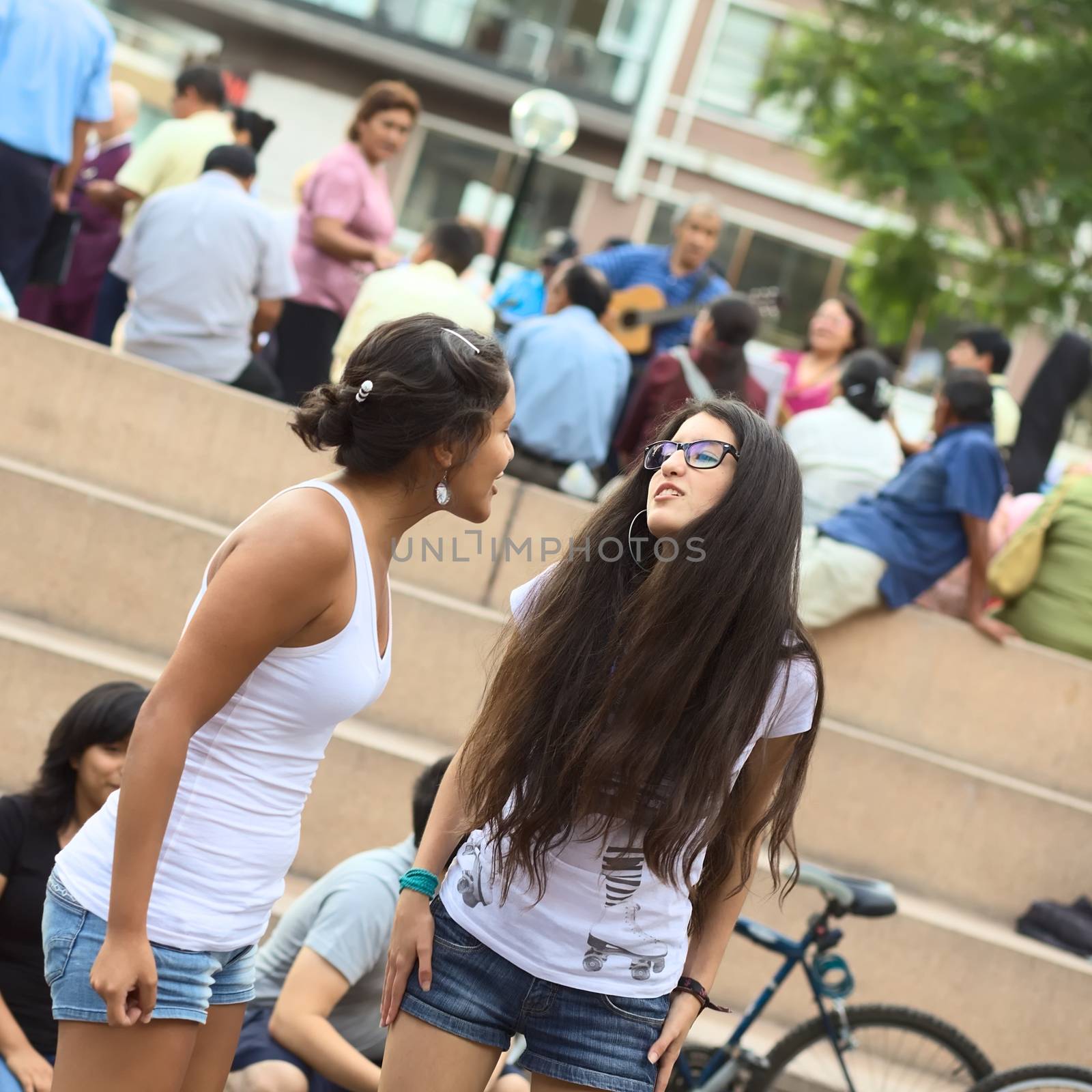 LIMA, PERU - MARCH 6, 2012: Unidentified young women playing improvisation in the amphitheatre of the Kennedy Park in Miraflores on March 6, 2012 in Lima, Peru. 