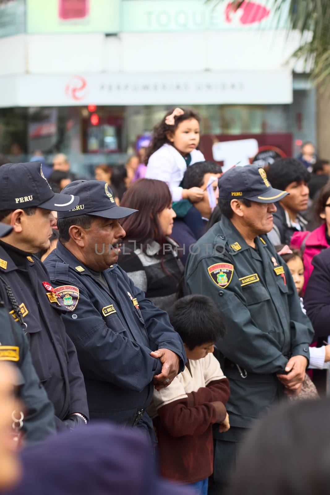 LIMA, PERU - JULY 21, 2013: Unidentified policemen on the Wong Parade in Miraflores on July 21, 2013 in Lima, Peru. The Parade (Gran Corso de Wong) is a traditional parade to celebrate the Peruvian national holiday which is on July 28-29.