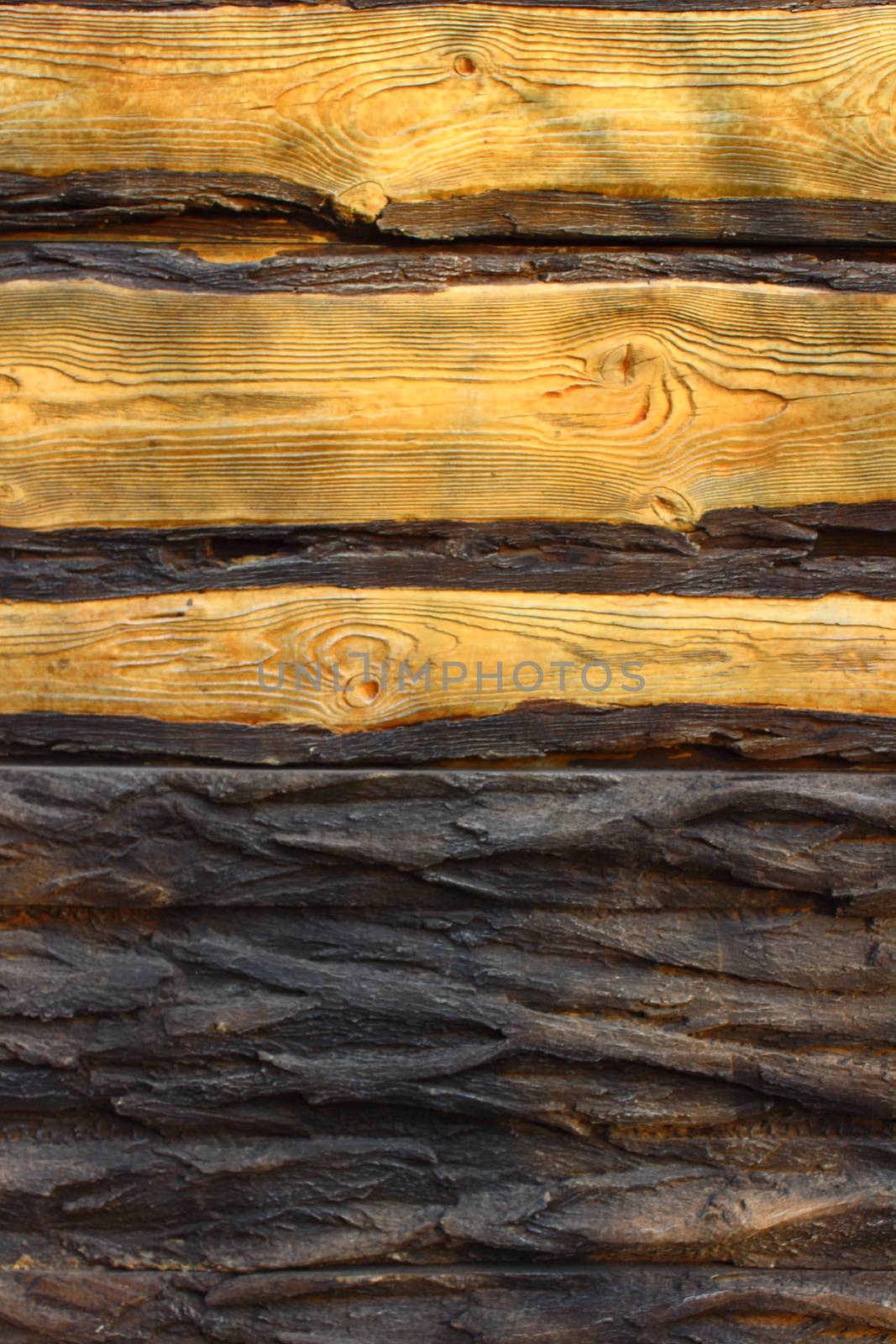 Light brown boards of wood and bark