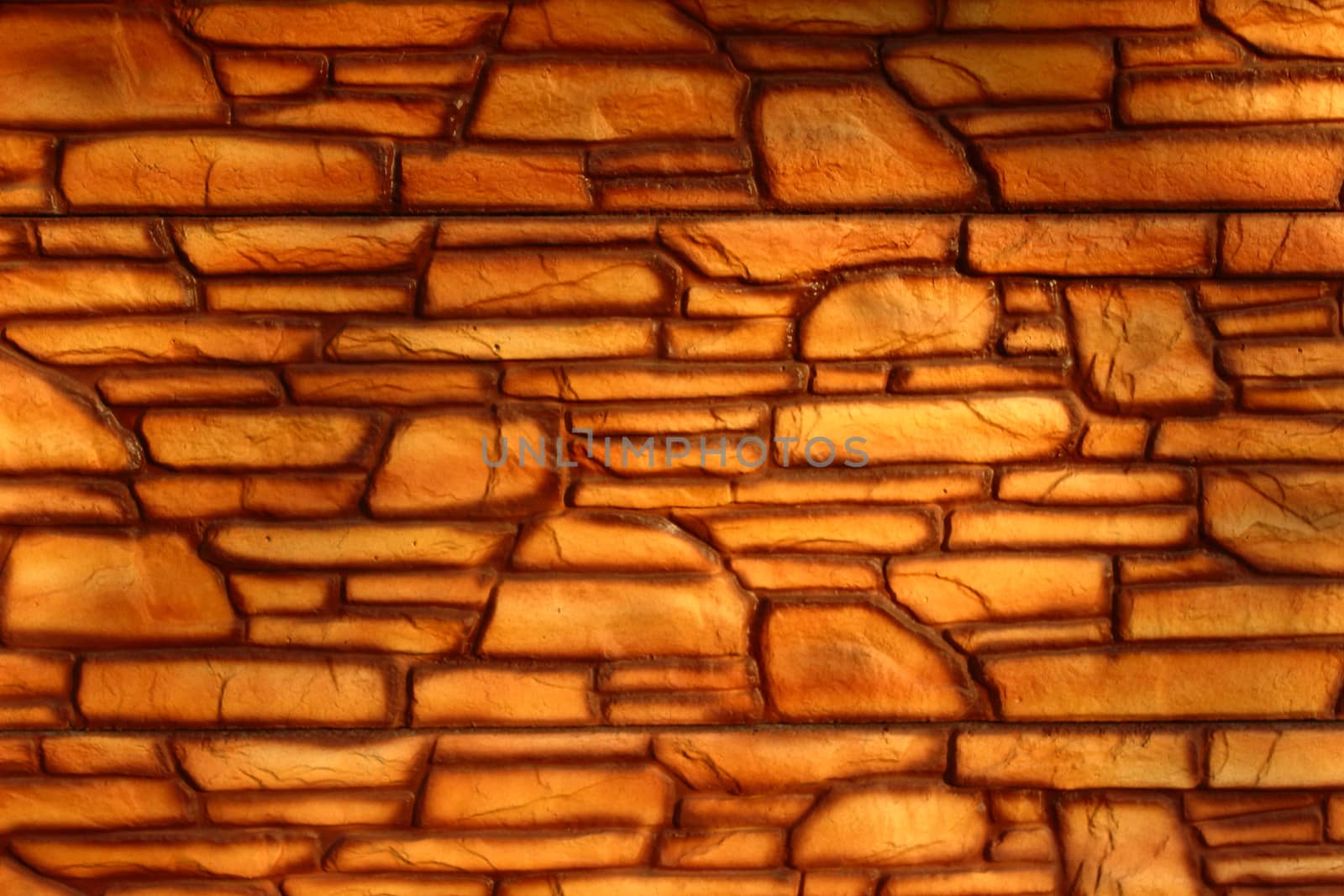 golden wall consists of stones of various shapes