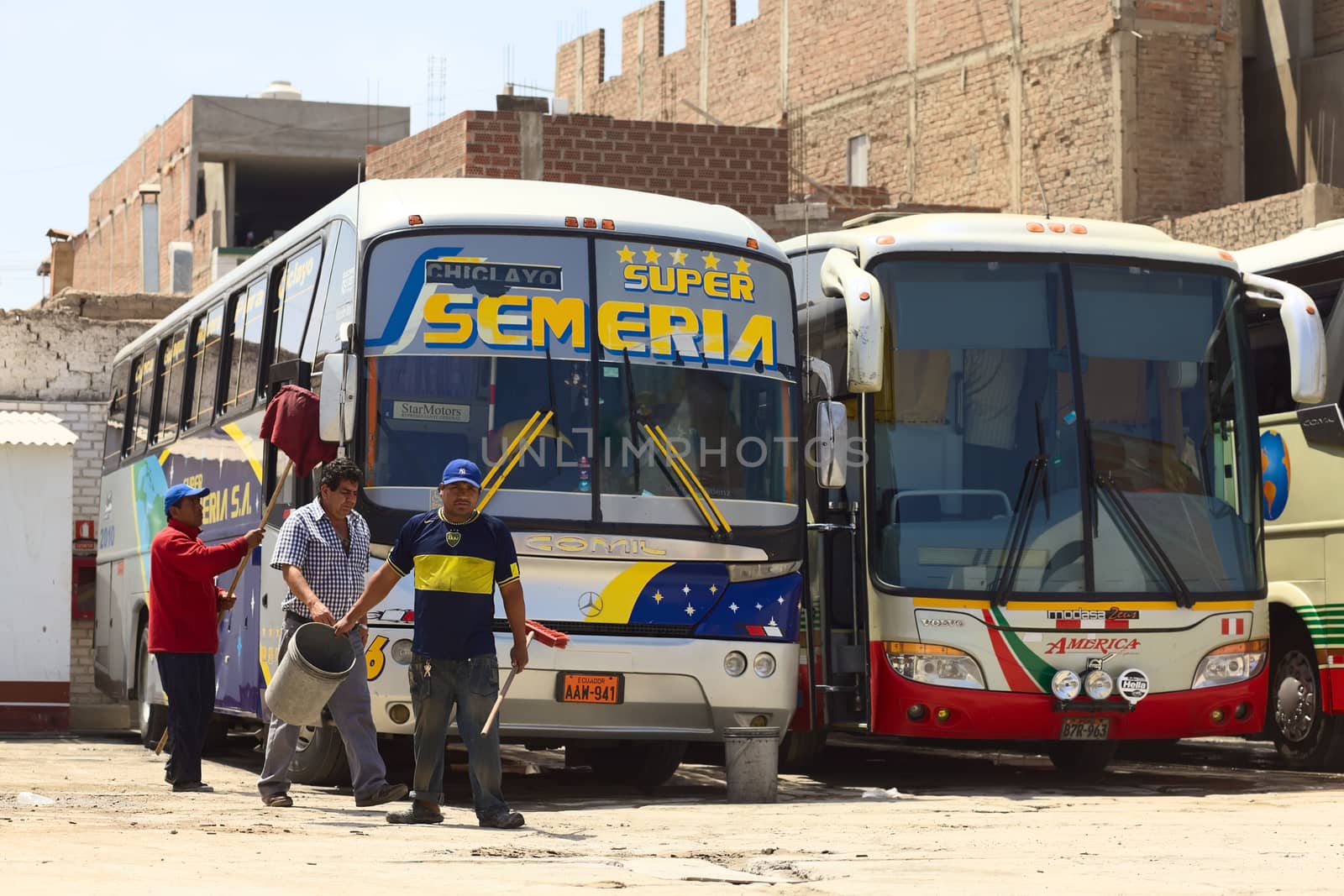 People Cleaning a Long-Distance Bus in Chiclayo, Peru by sven