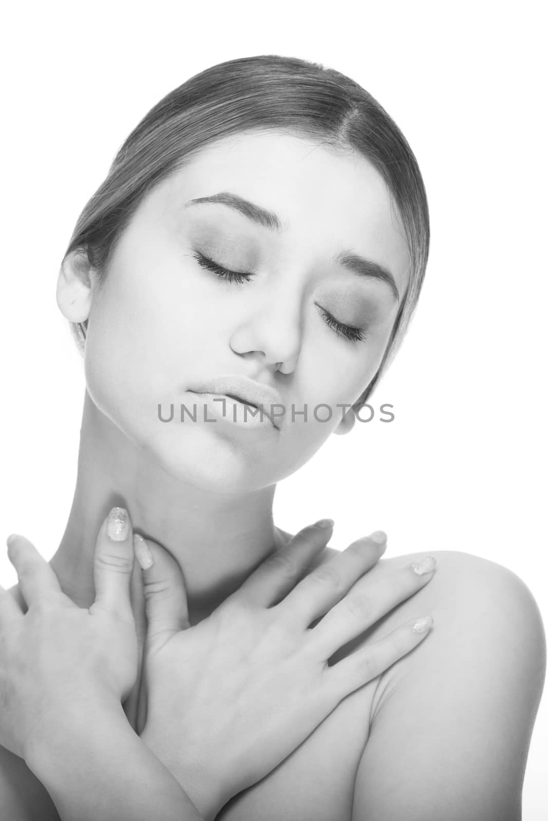 Black and white high key beautiful Caucasian girl model isolated on white with closed eyes