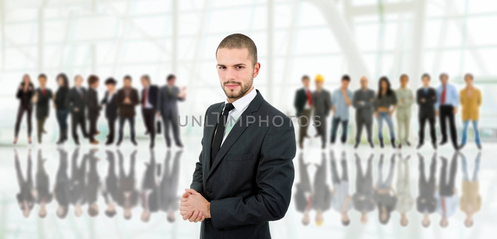 business man in front of a group of people at the office