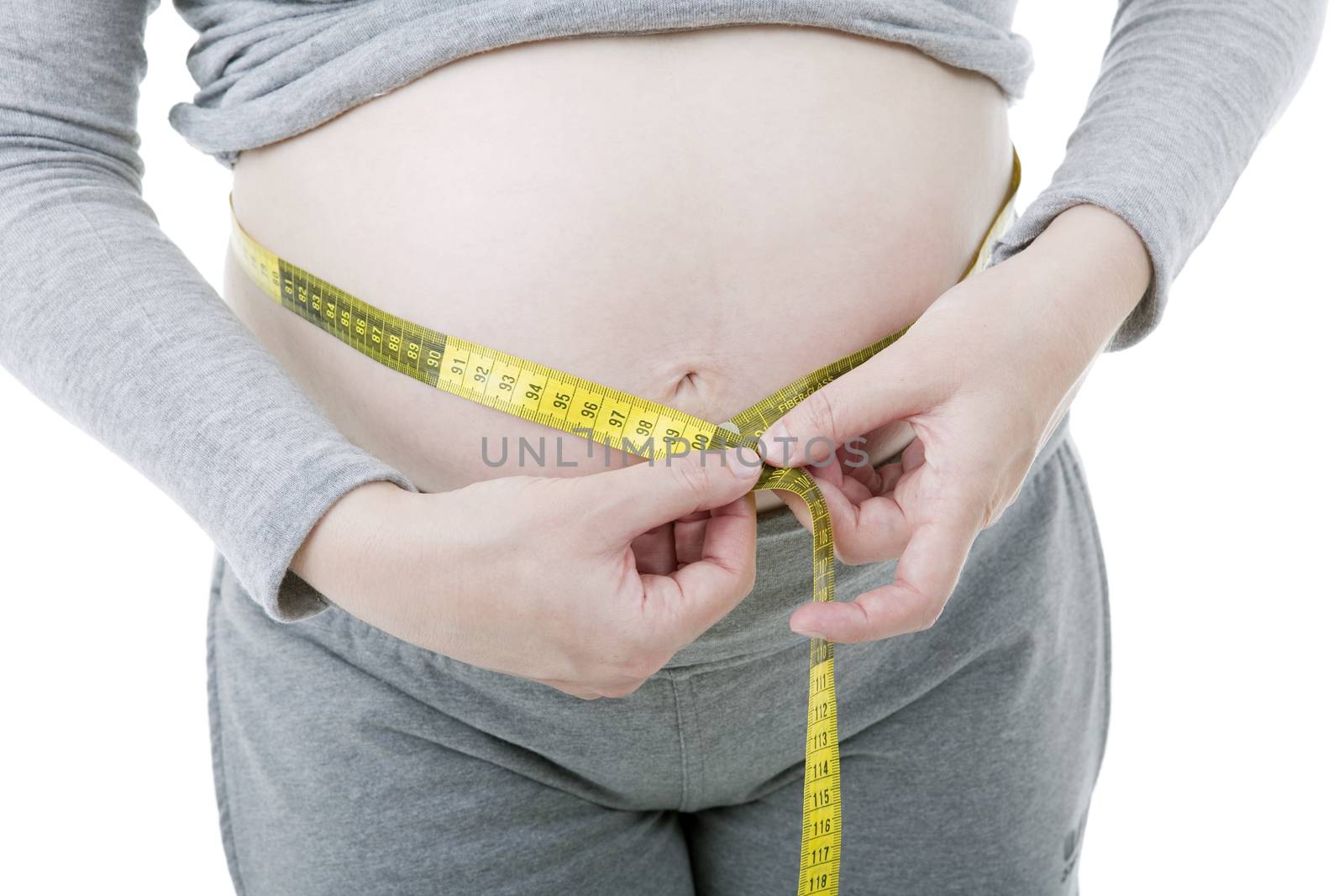 Closeup of pregnant woman at white background