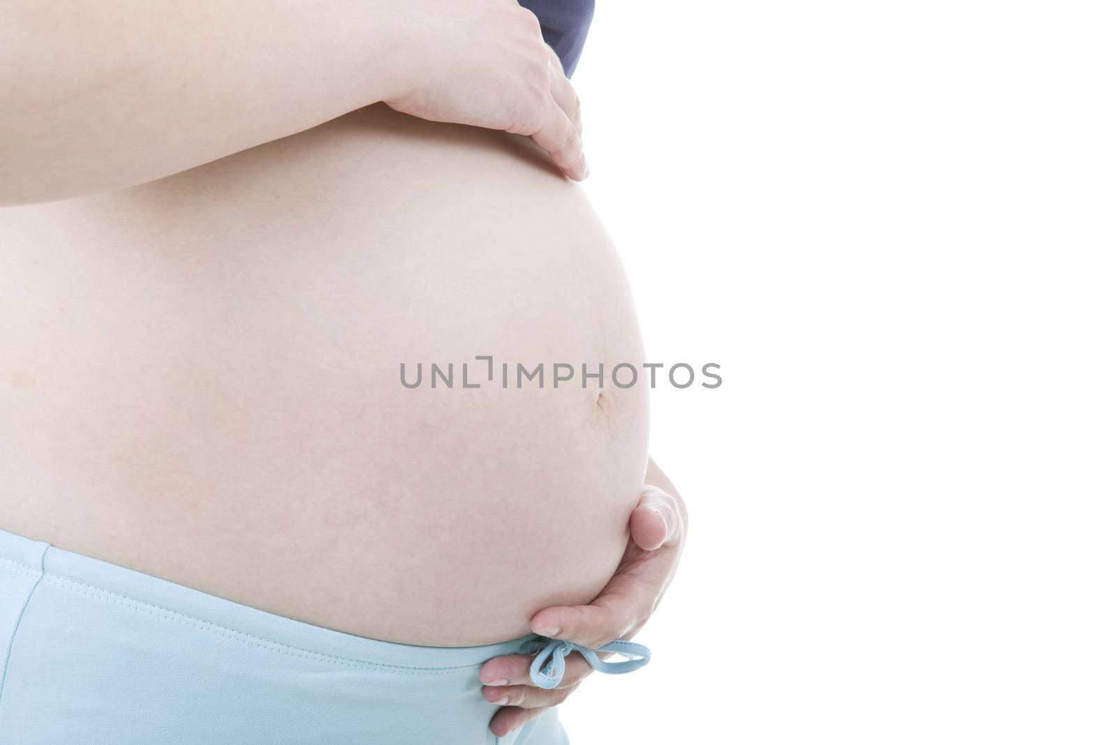 Closeup of pregnant woman at white background