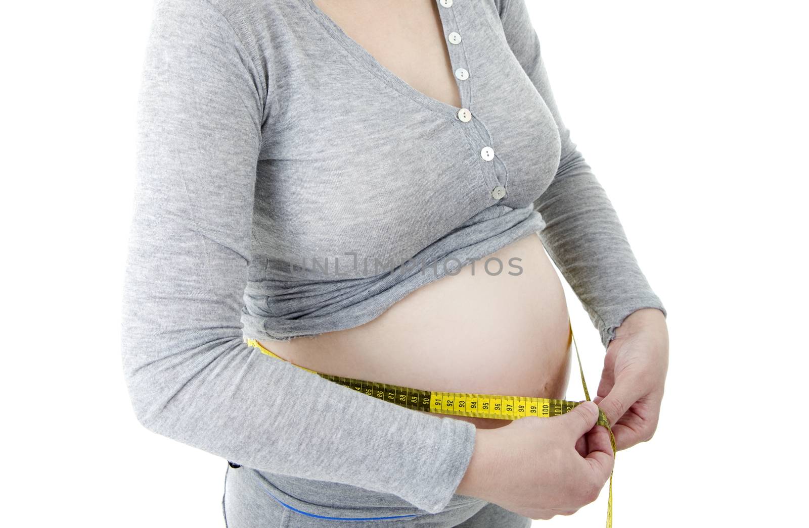 Closeup of pregnant woman at white background