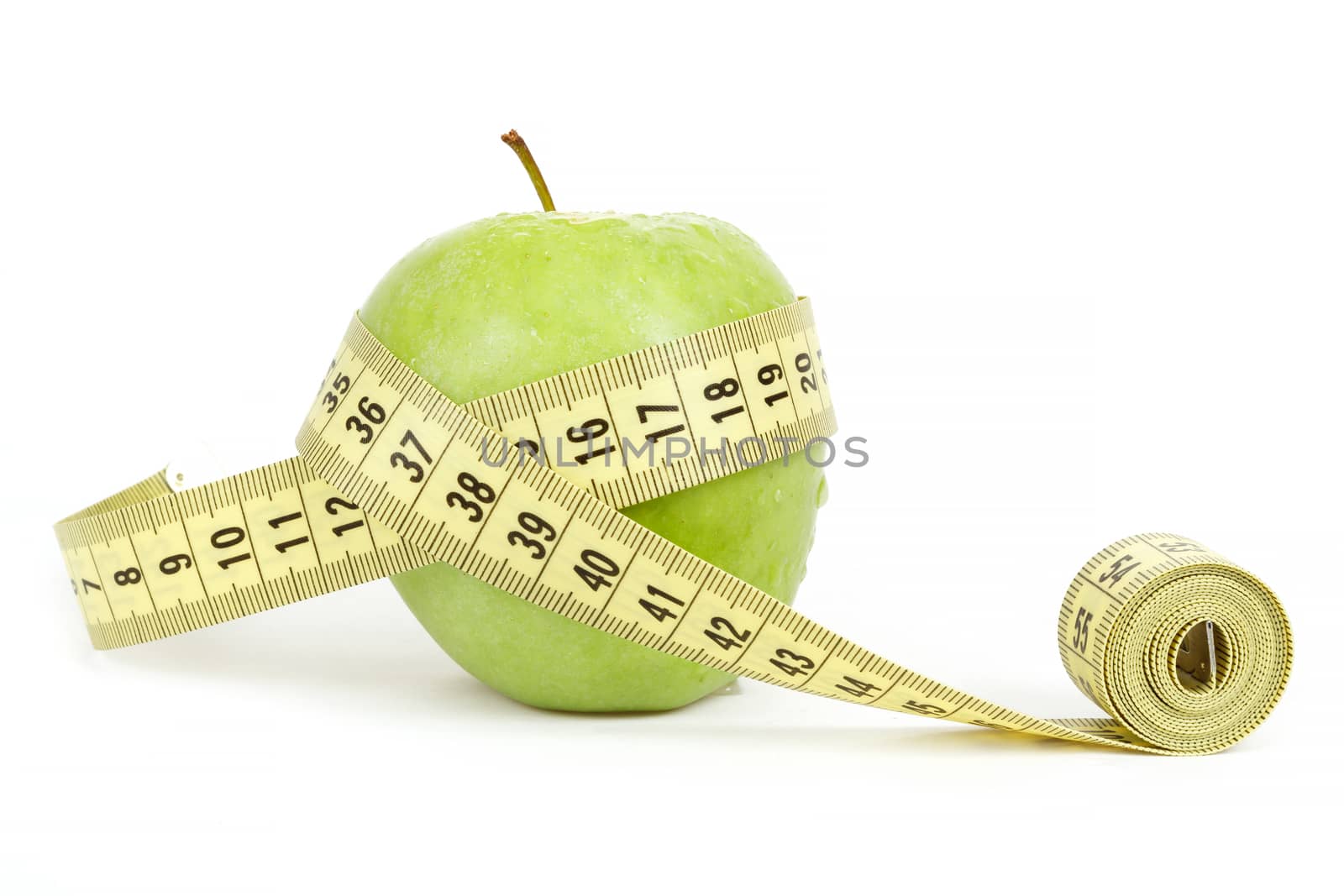 green apple with a measuring tape and heart symbol isolated on white background 