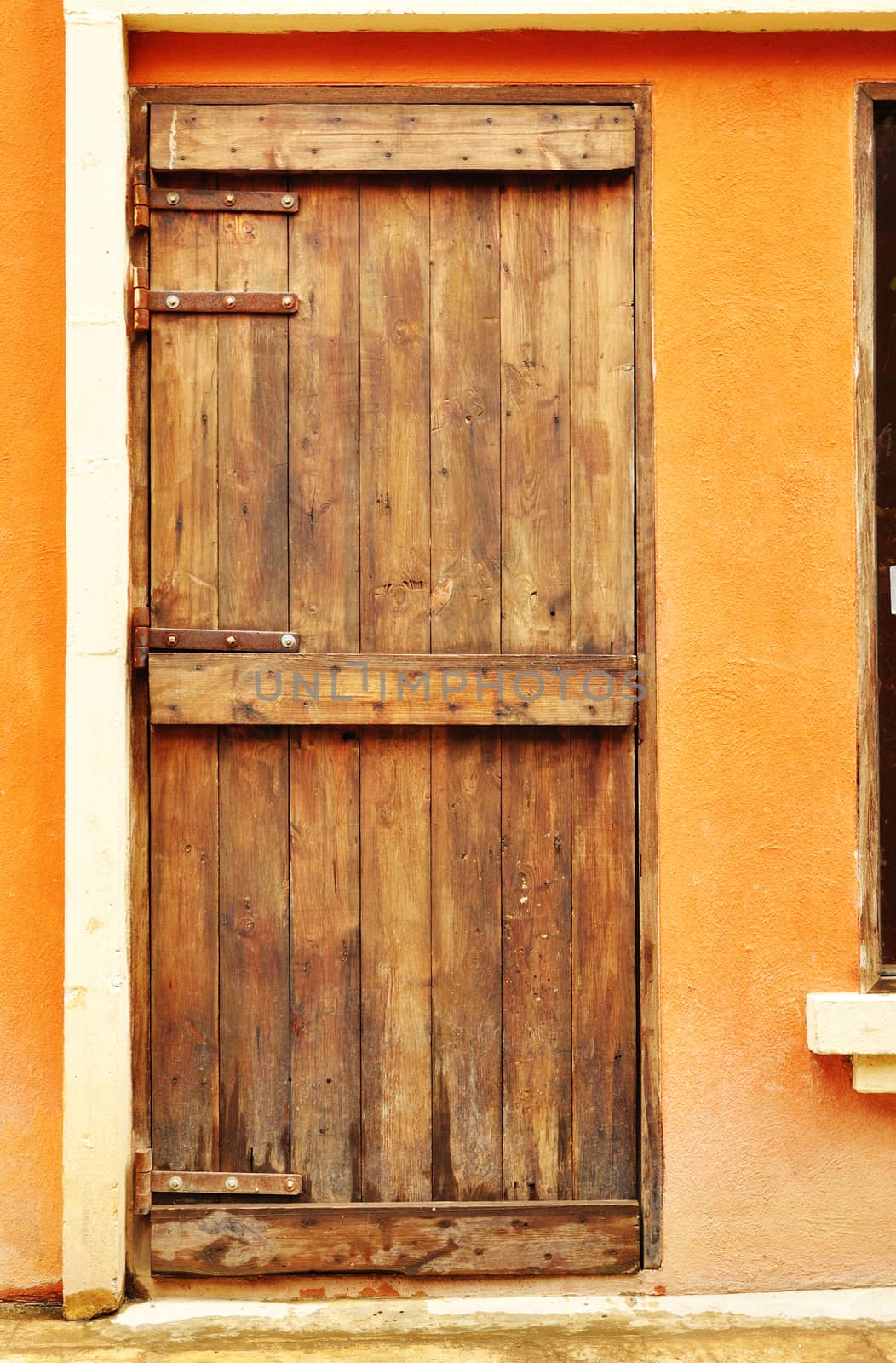 European style wood door on concrete wall by thampapon