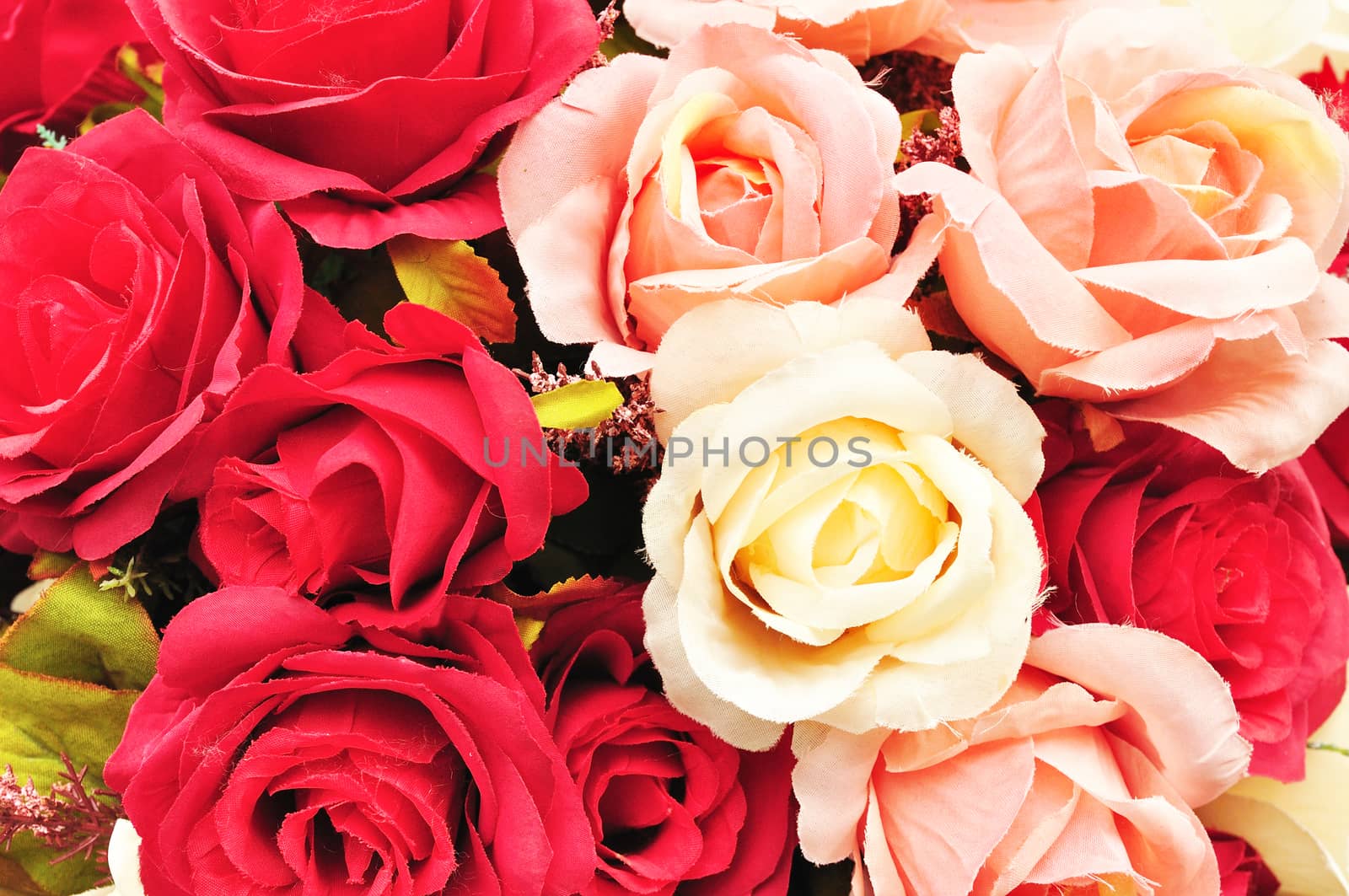 Close up colorful imitation or artificial rose flower background