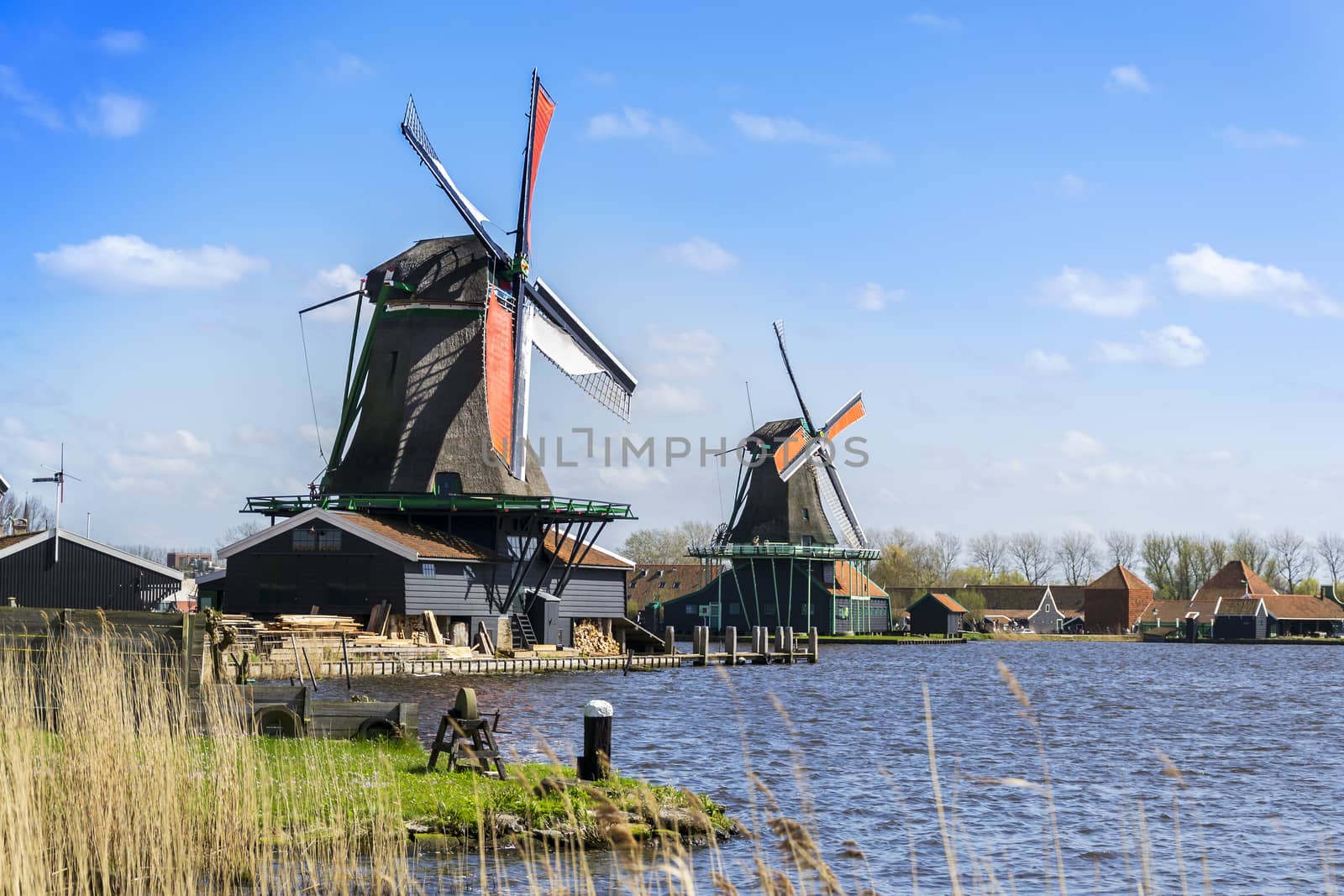 View of two windmills in Zaanse Schans near Amsterdam