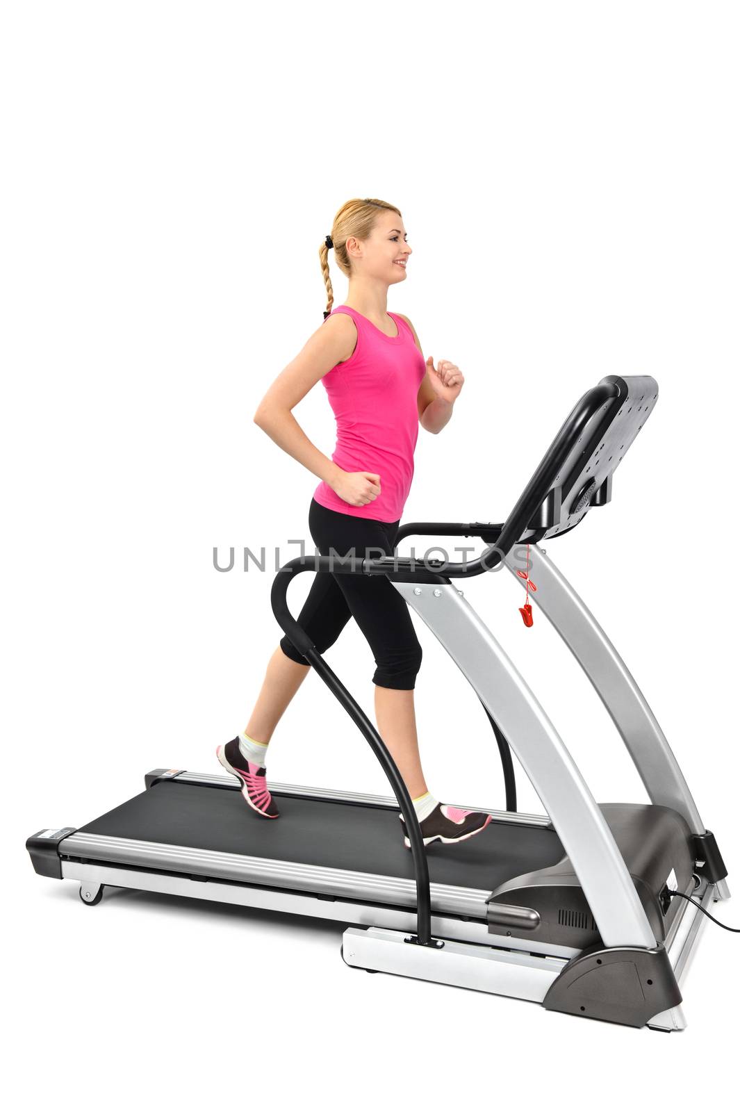 young woman doing exercises on treadmill by starush