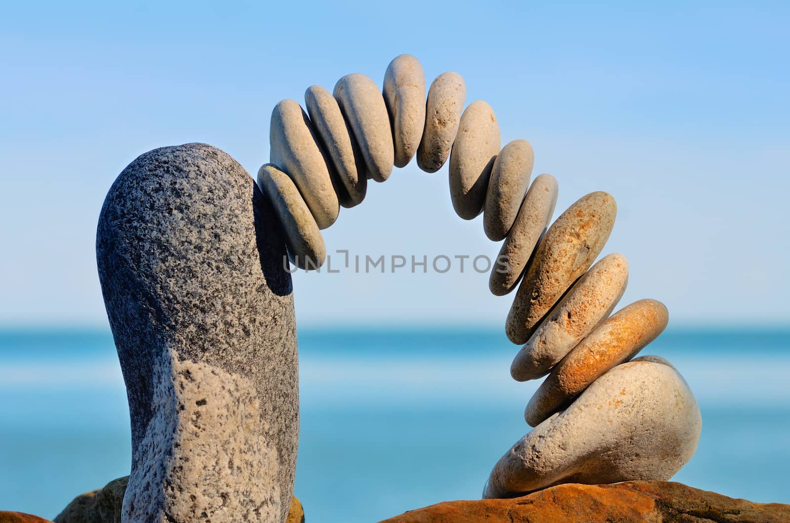 Balancing of pebbles each other on the seacoast