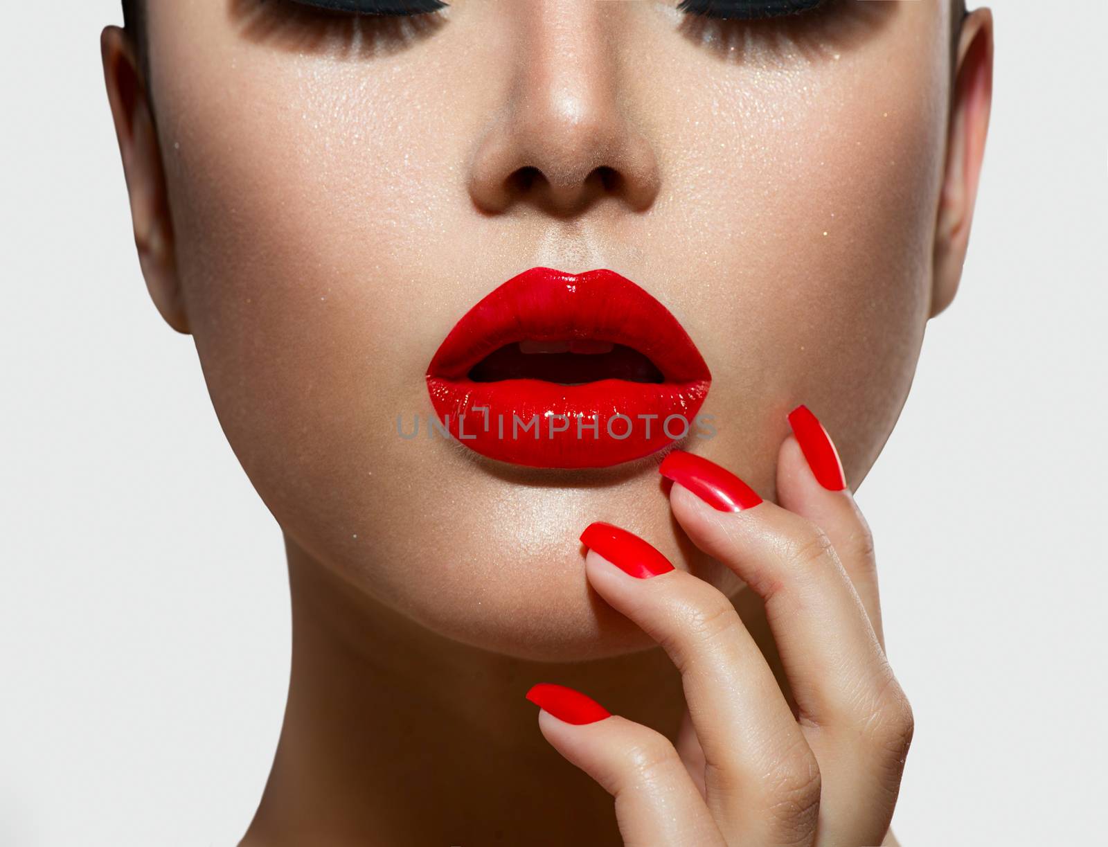 Red Sexy Lips and Nails closeup. Manicure and Makeup by SubbotinaA