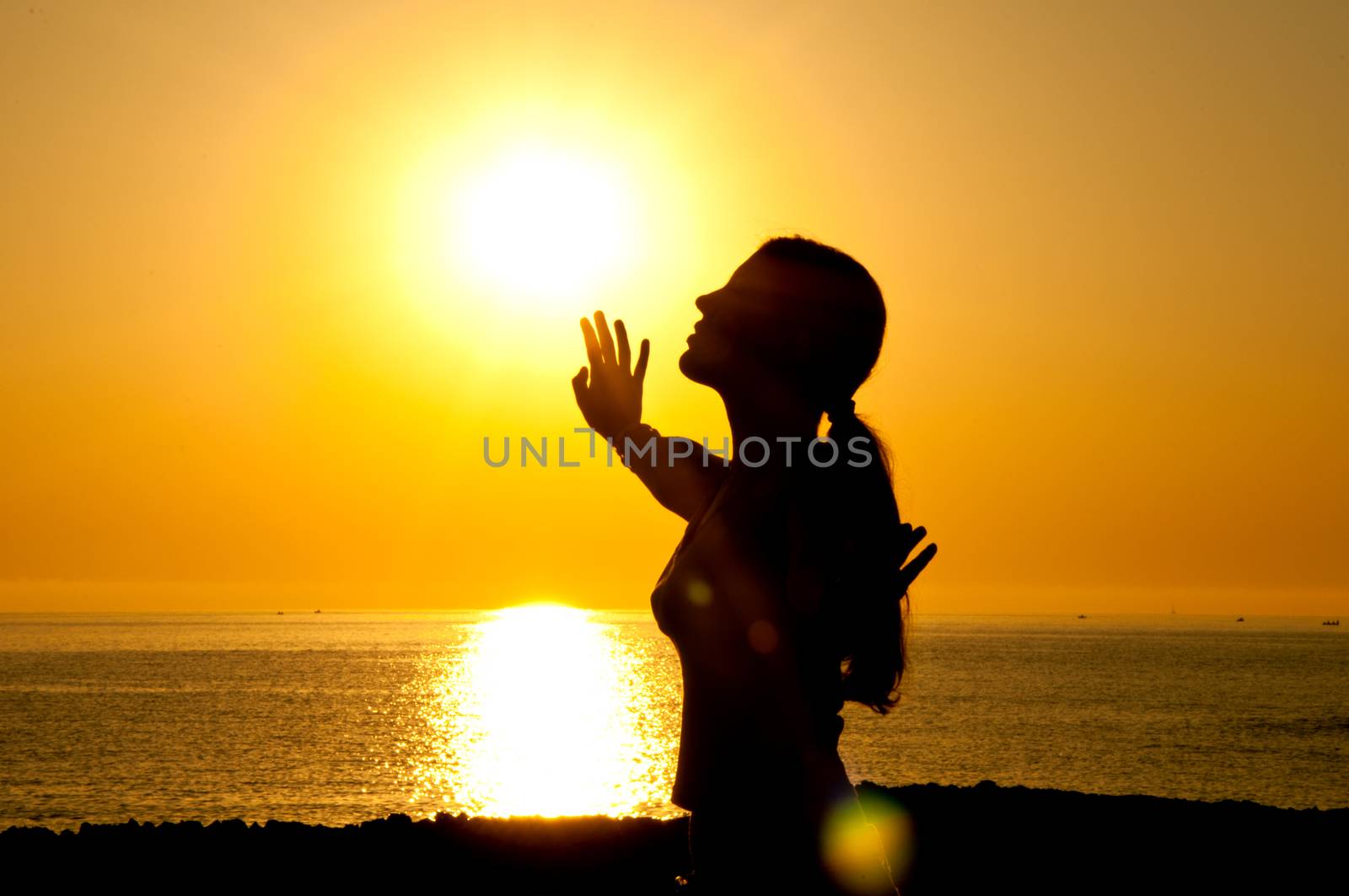 A beautiful girl silhouette free in the sun