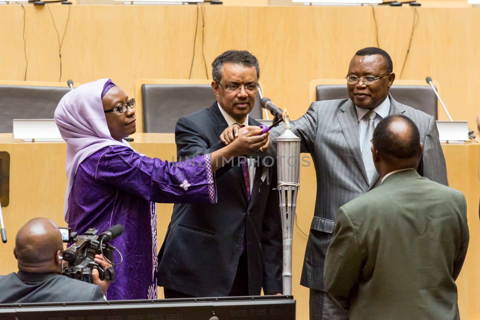 Addis Ababa, Ethiopia - April, 2014: Foreign minister of Ethiopia Dr. Tedros Adhanom, and Ambassador Nsengimana light the relay of a “flame of remembrance" which symbolizes memory, hope and preventing genocide, on 11 April, 2014, in Addis Ababa, Ethiopia