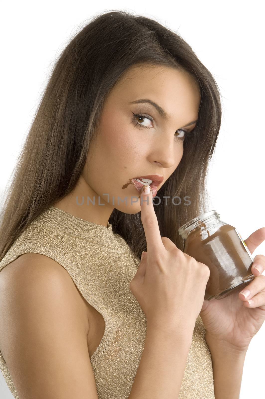 sexy and cute brunette eating some chocolate cream from her finger