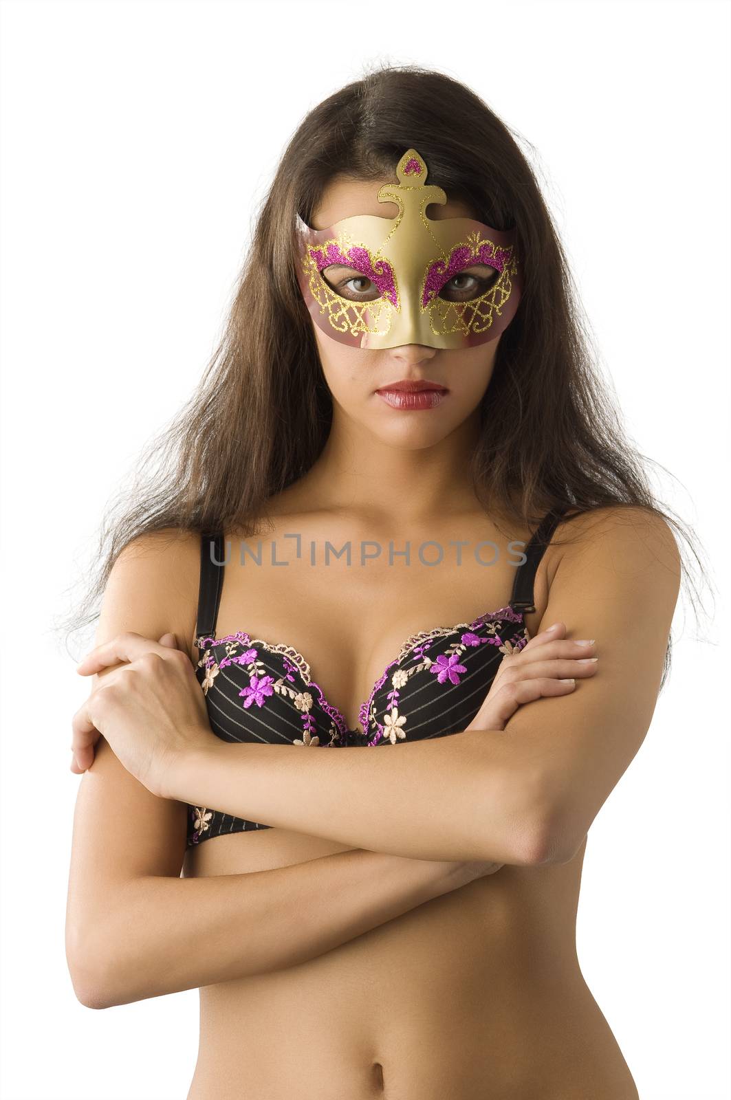 sensual brunette in underwear giving a glace behind carnival mask