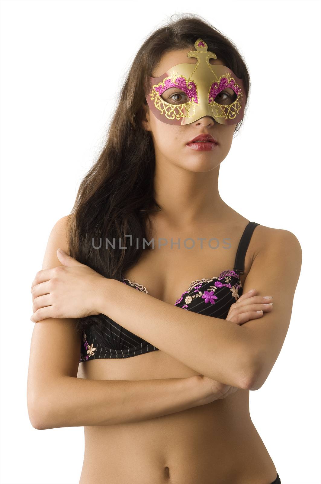 very nice girl with long hair in bra and carnival mask looking in camera