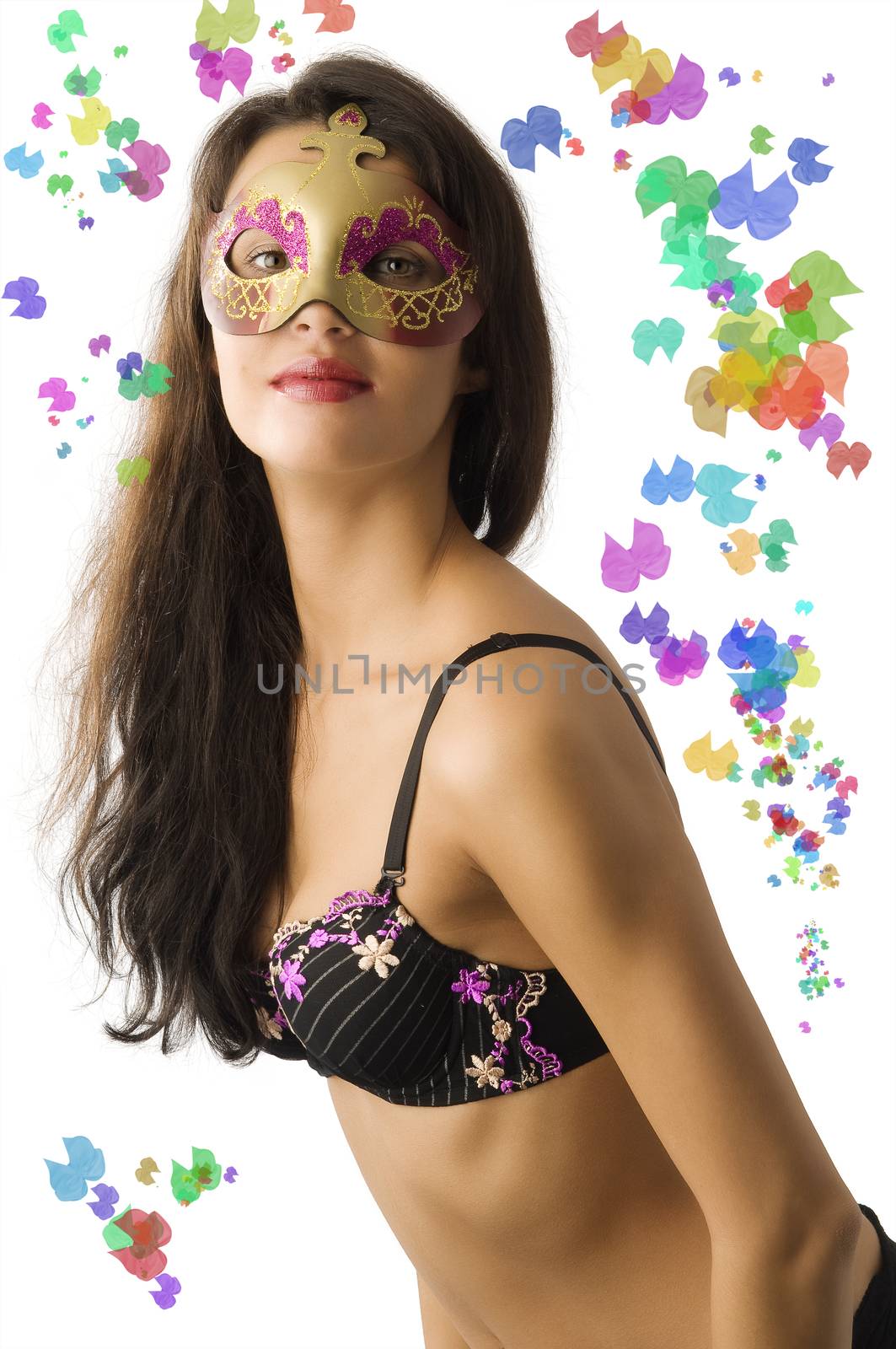 beautiful brunette wearing her bra lingerie hiding face with golden mask