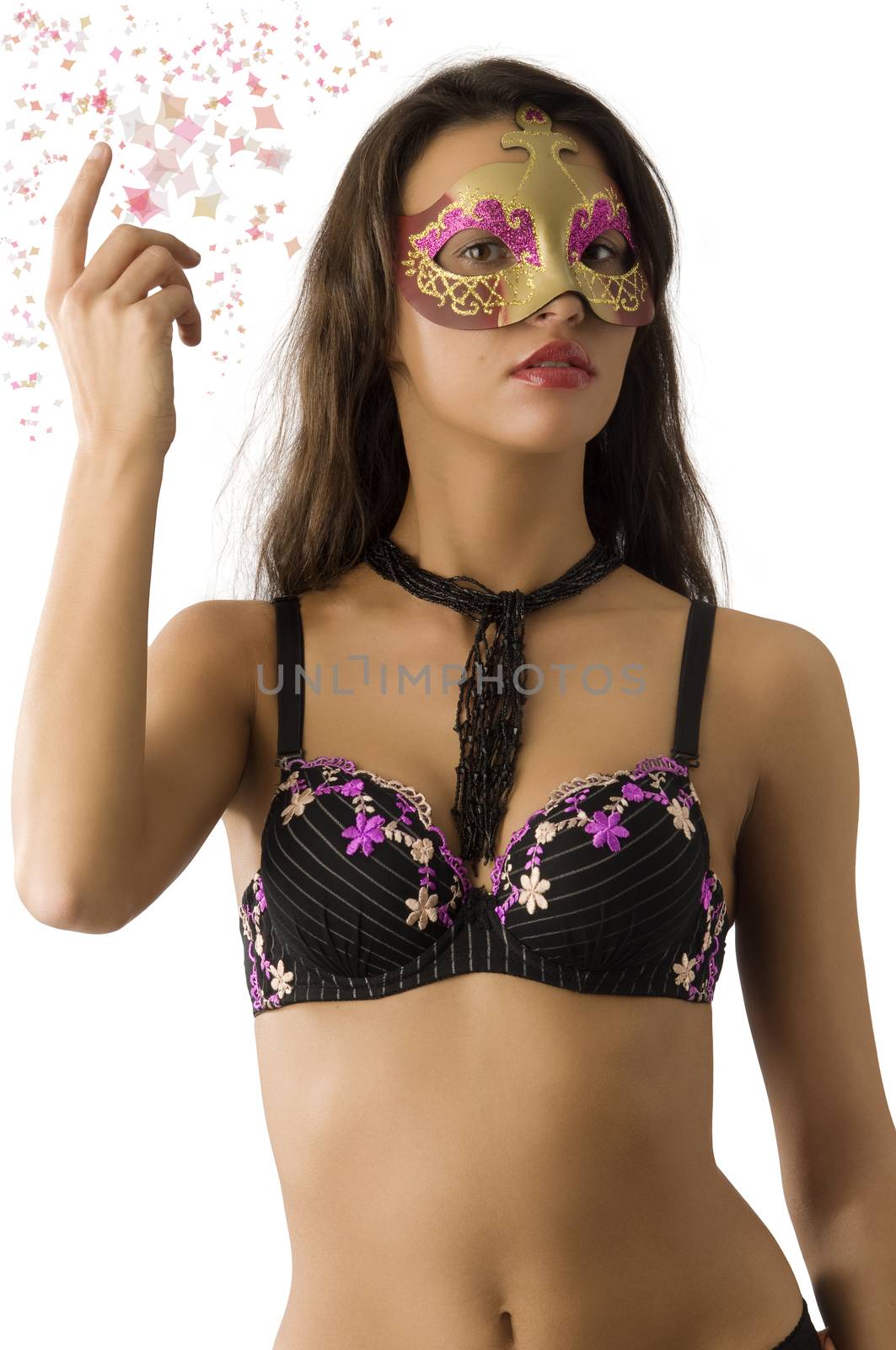 sensual brunette showing her bra and hiding face behind a carnival mask