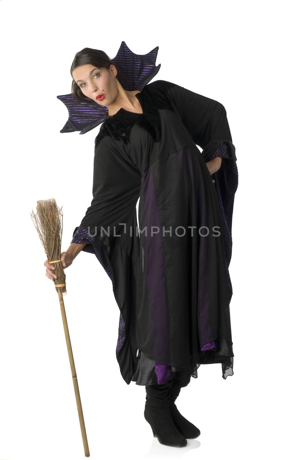 funny and nice witch making facial expression and taking funny pose